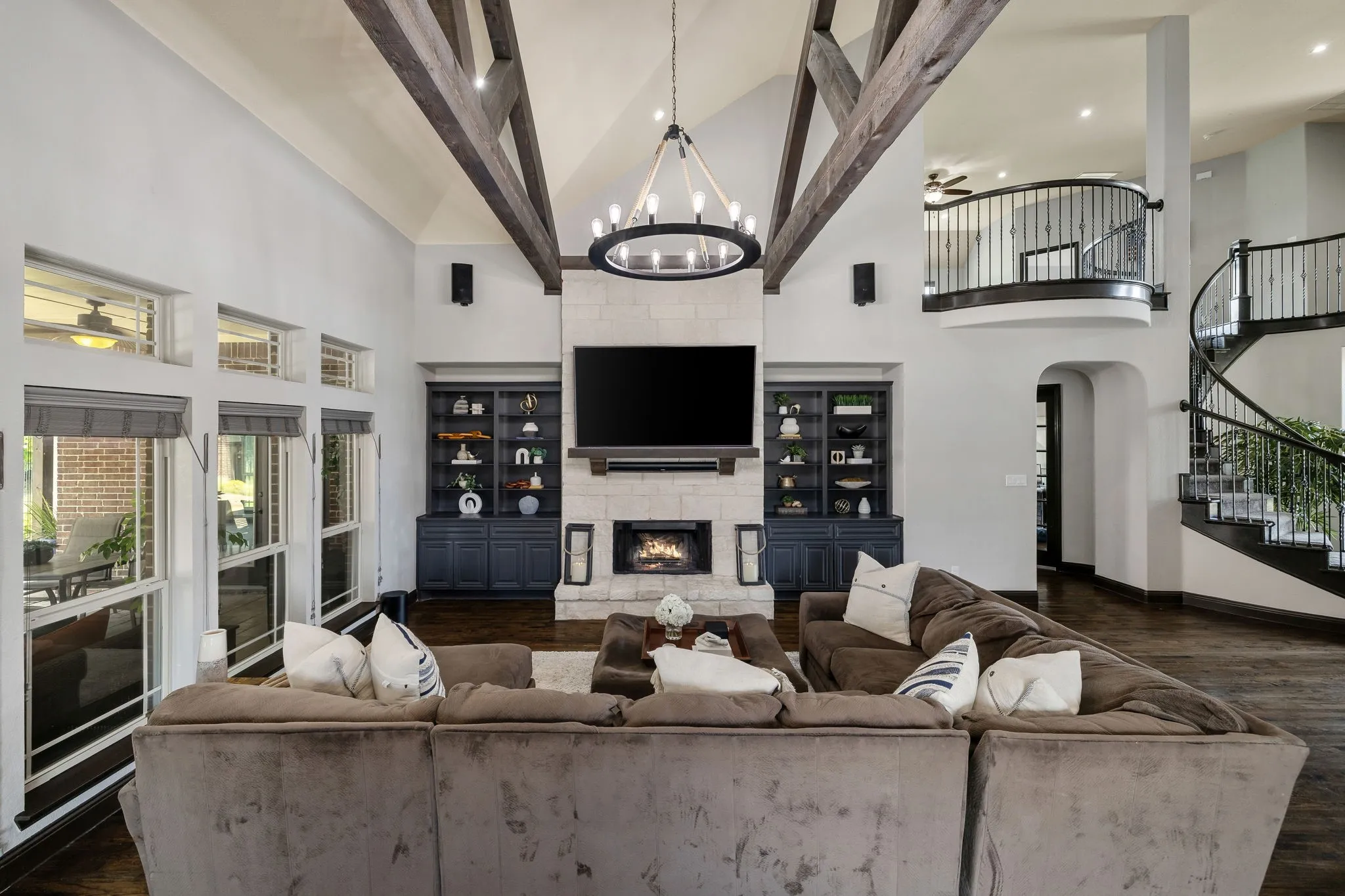 Double stacked bookcases with a cozy oversized living room