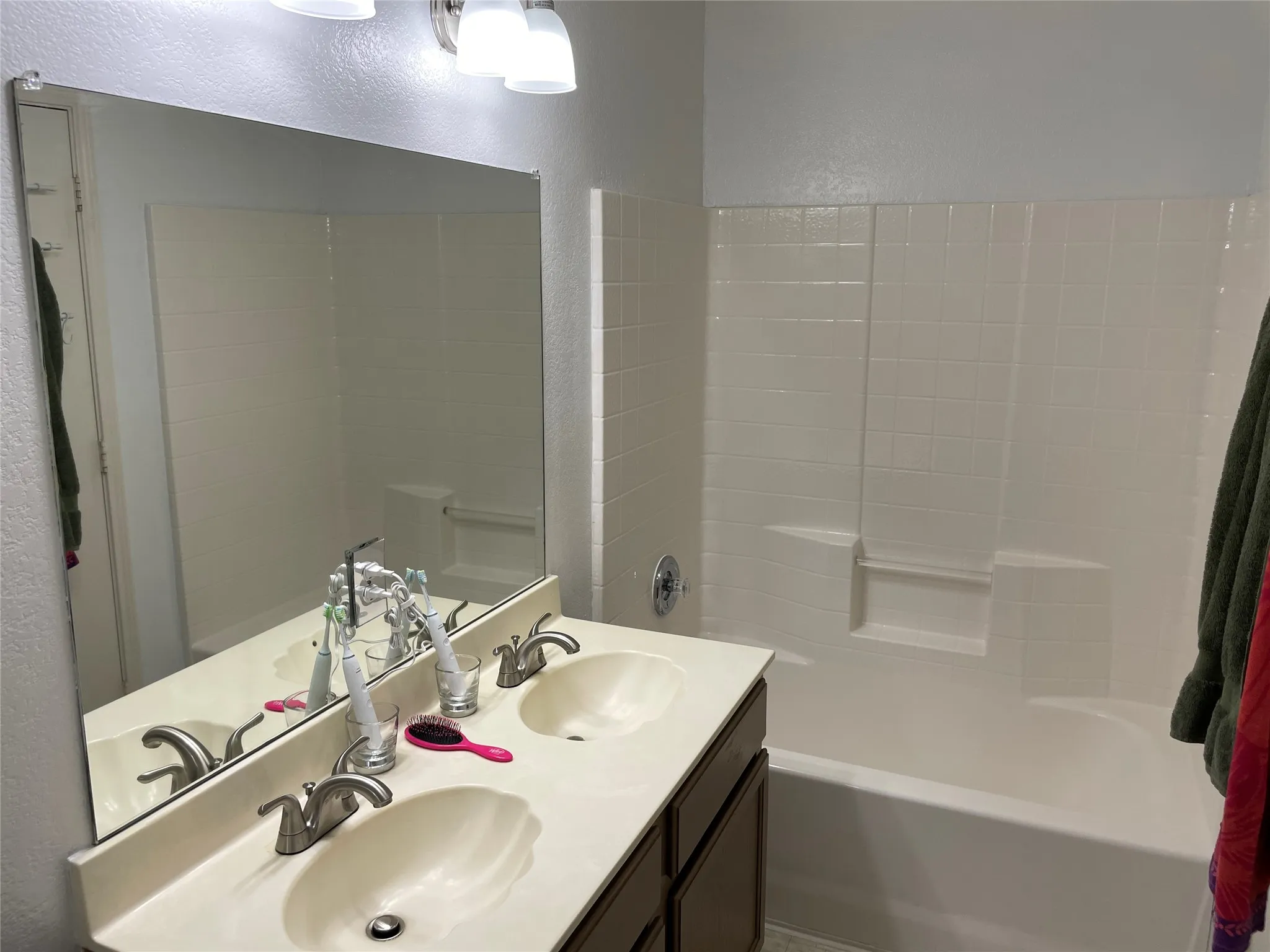 Bathroom featuring a tub to relax in and vanity