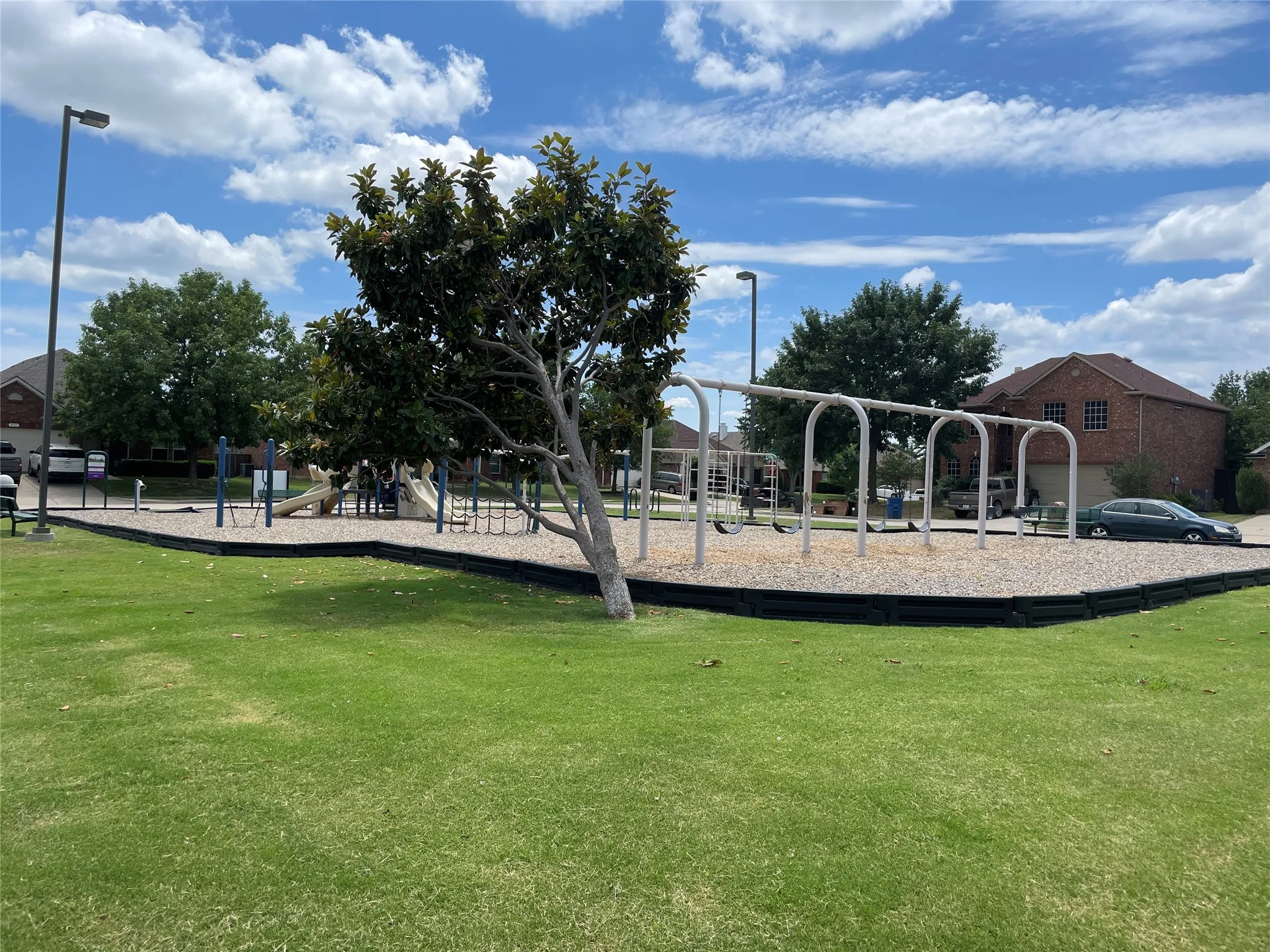 View of jungle gym with a yard