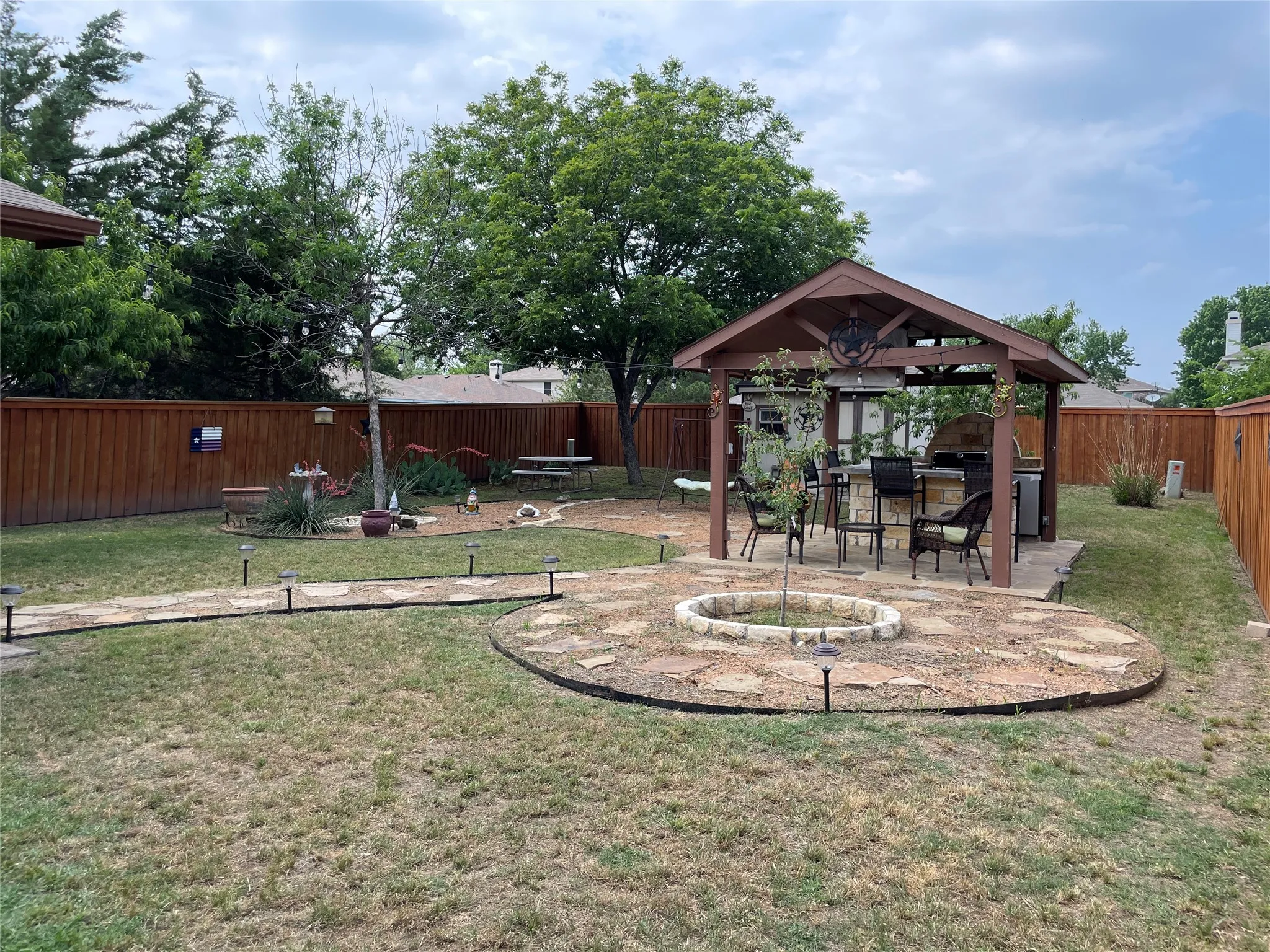 View of yard with a gazebo and a patio area