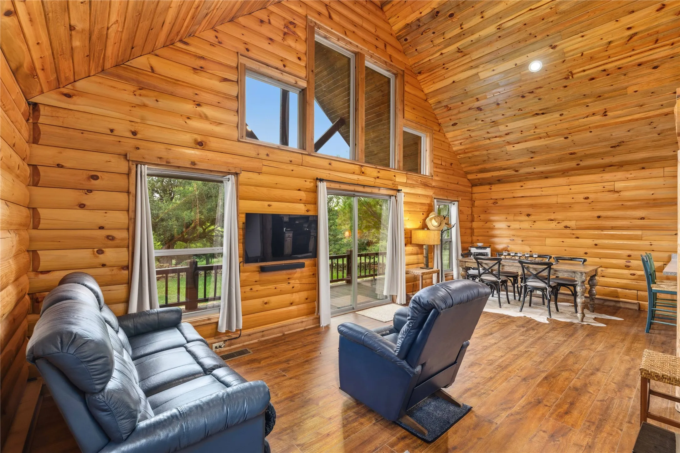 Vaulted ceiling with natural wood paneling throughout
