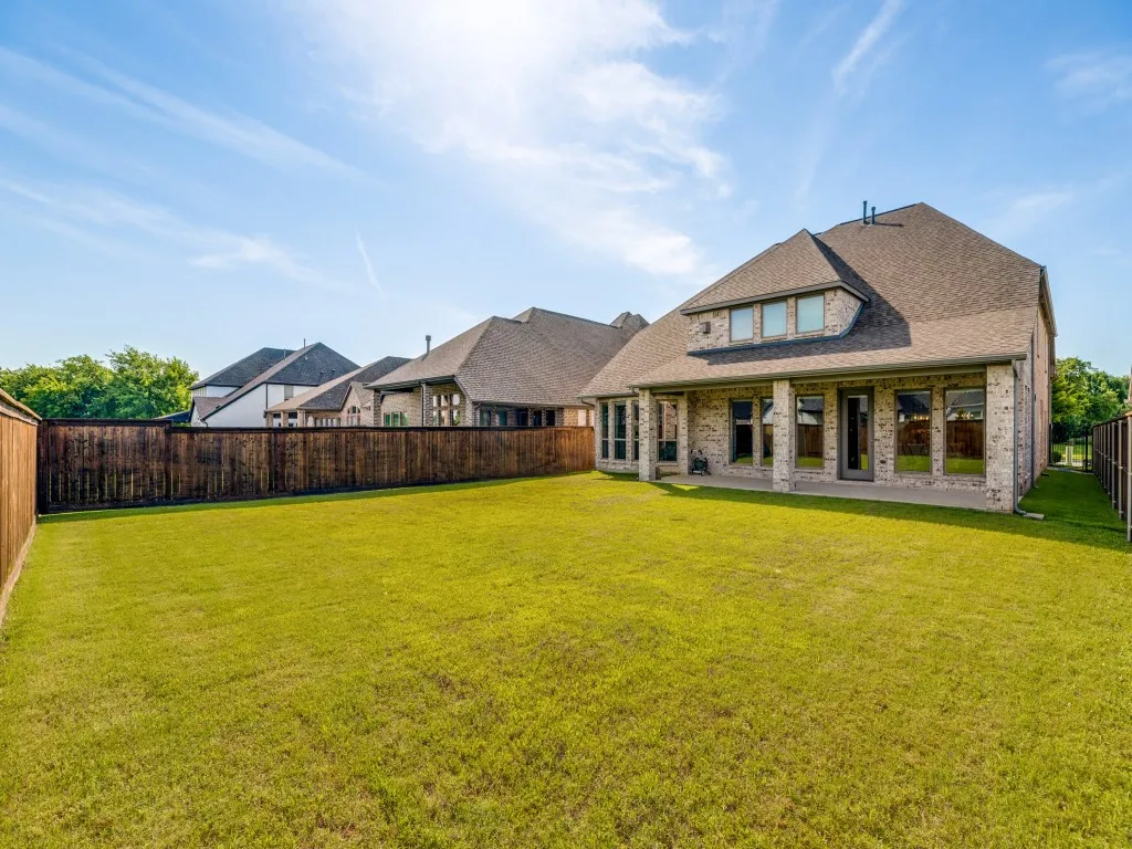 Large backyard with room for pool and playset. Extended covered patio.