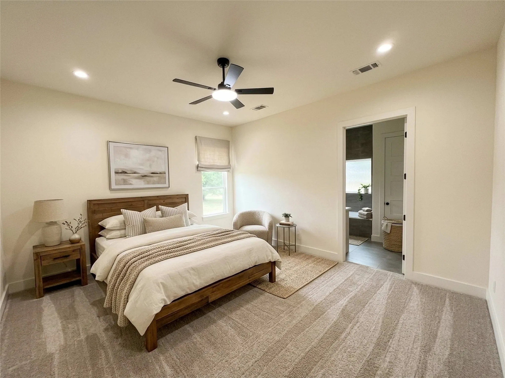 Carpeted bedroom featuring a ceiling fan with integrated lighting, recessed lighting, and a window with a Roman shade
