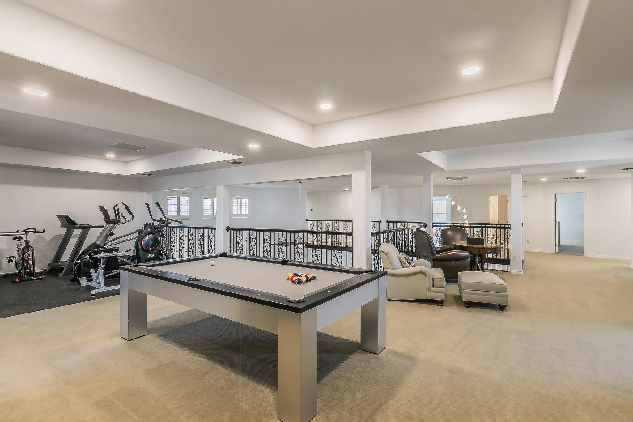 Game room featuring a tray ceiling, recessed lighting, pool table, baseboards, and light colored carpet