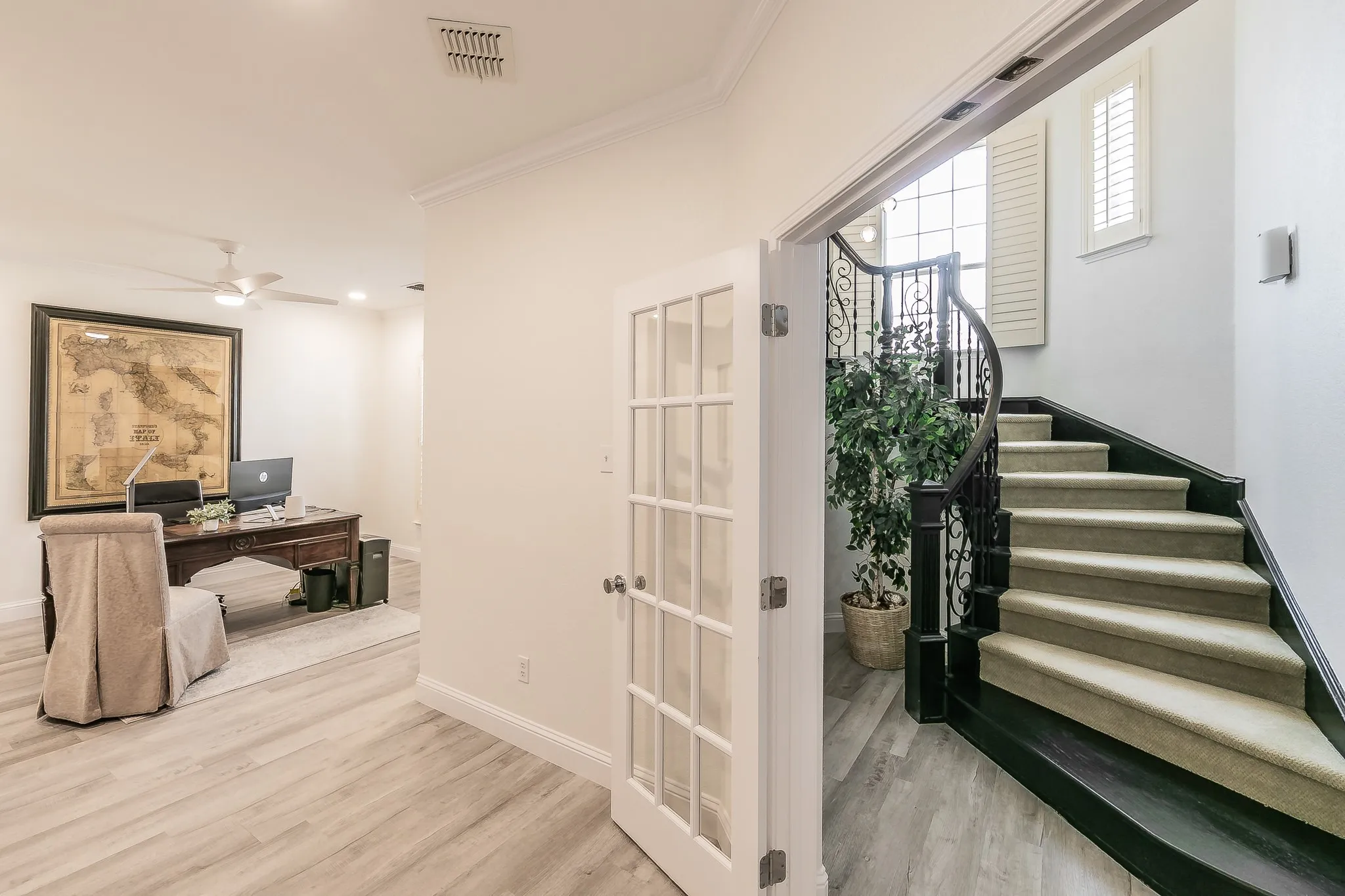 Office space, baseboards, wood finished floors, and crown molding