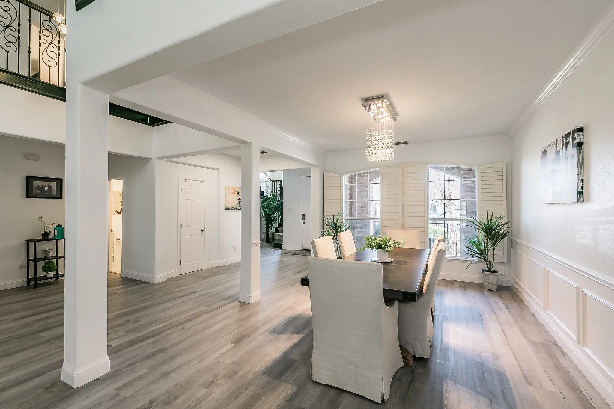 Office space, baseboards, wood finished floors, and crown molding