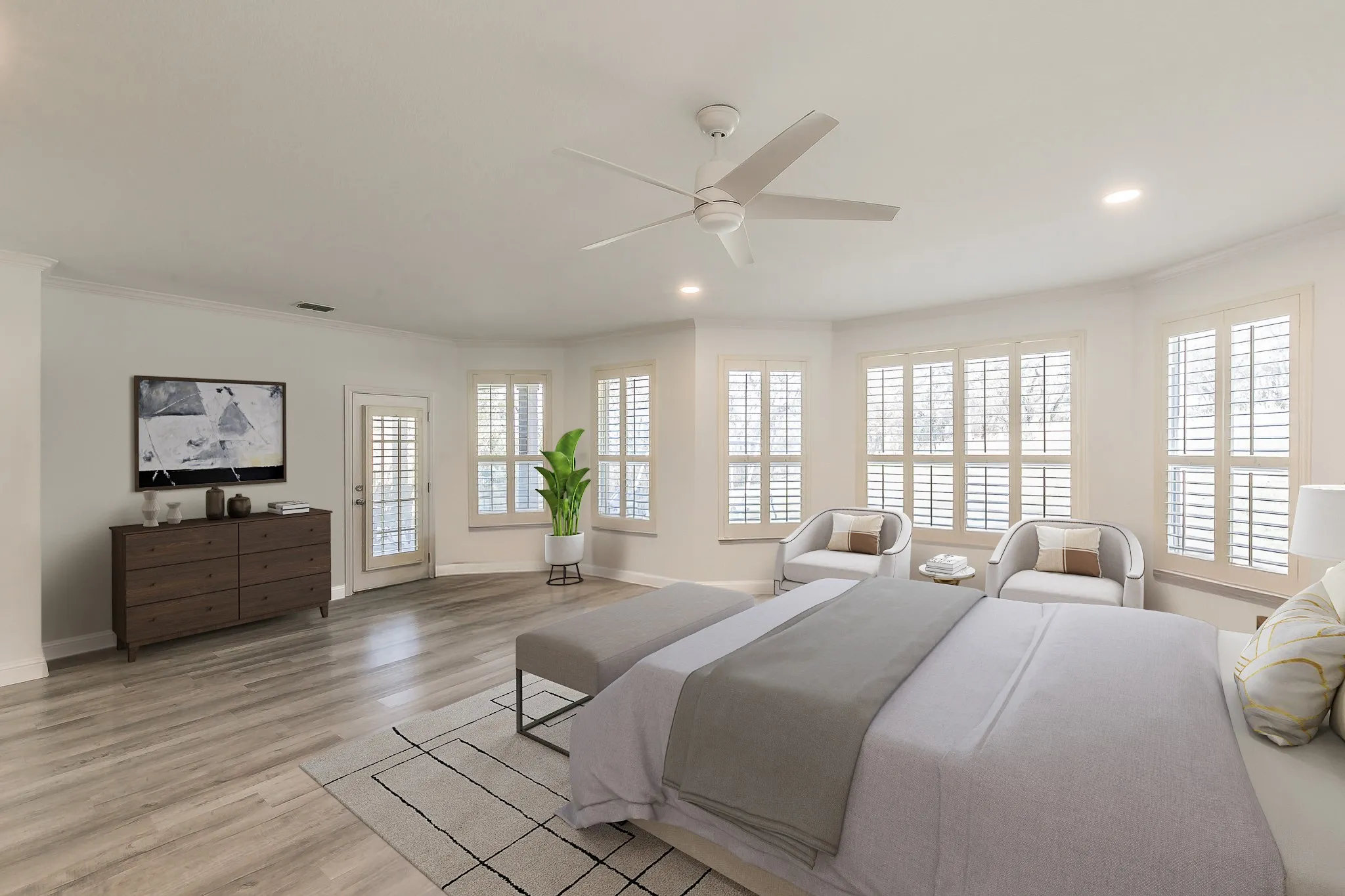 Bedroom featuring light wood-style flooring, crown molding, baseboards, and ceiling fan. Virtually staged.