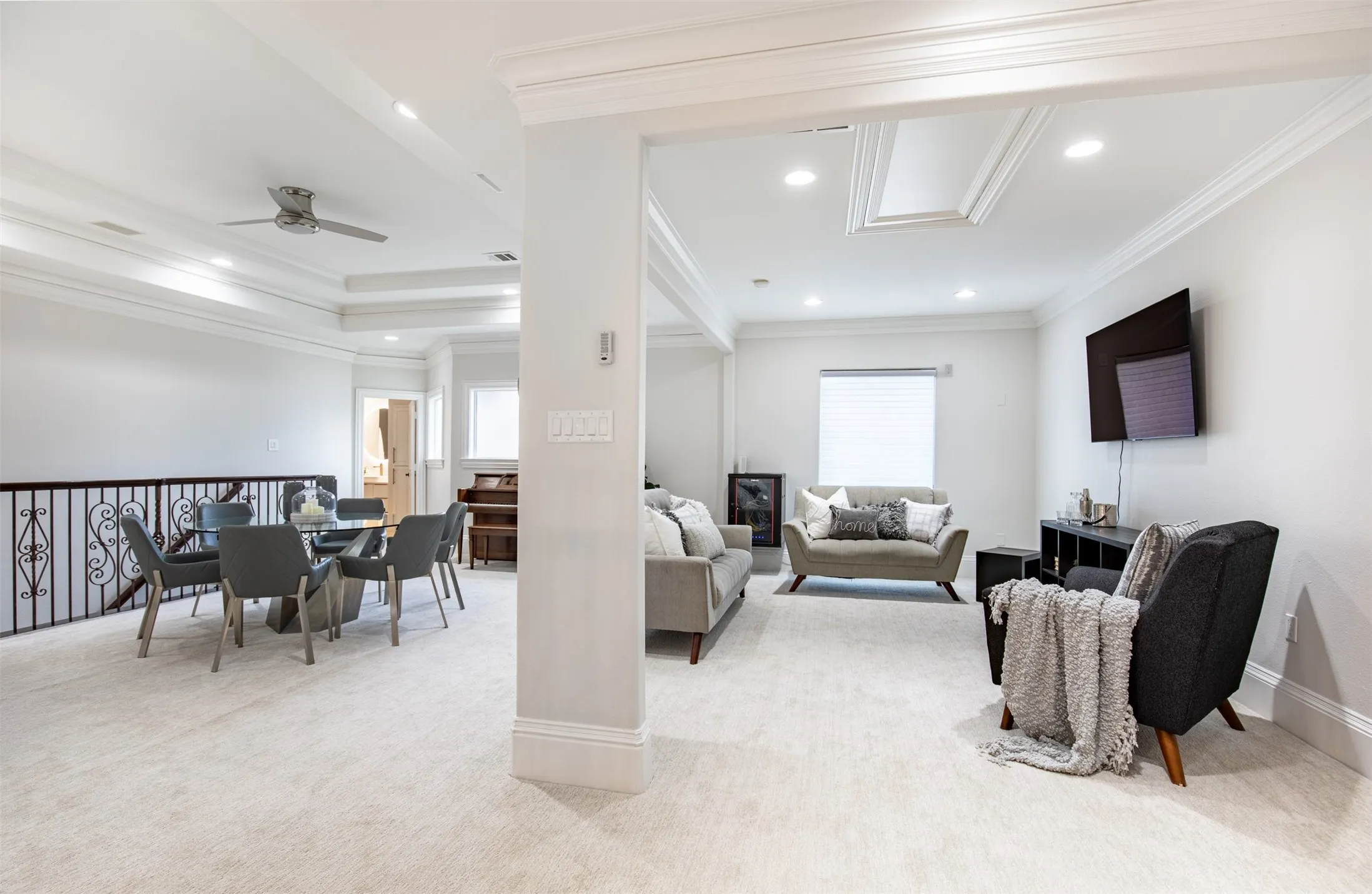 Open loft area featuring recessed lighting and crown molding