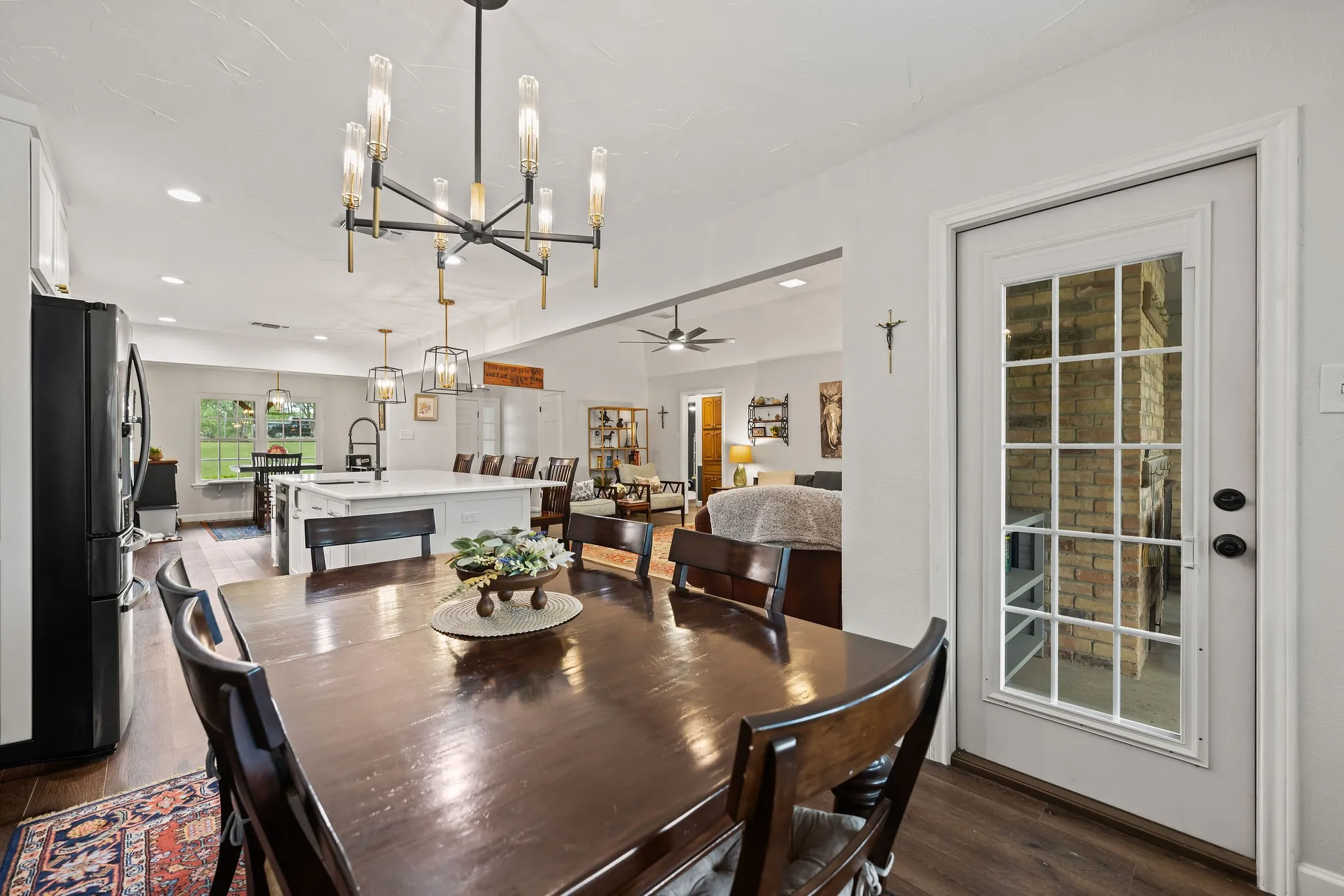 Open-concept living area with wood-finish flooring