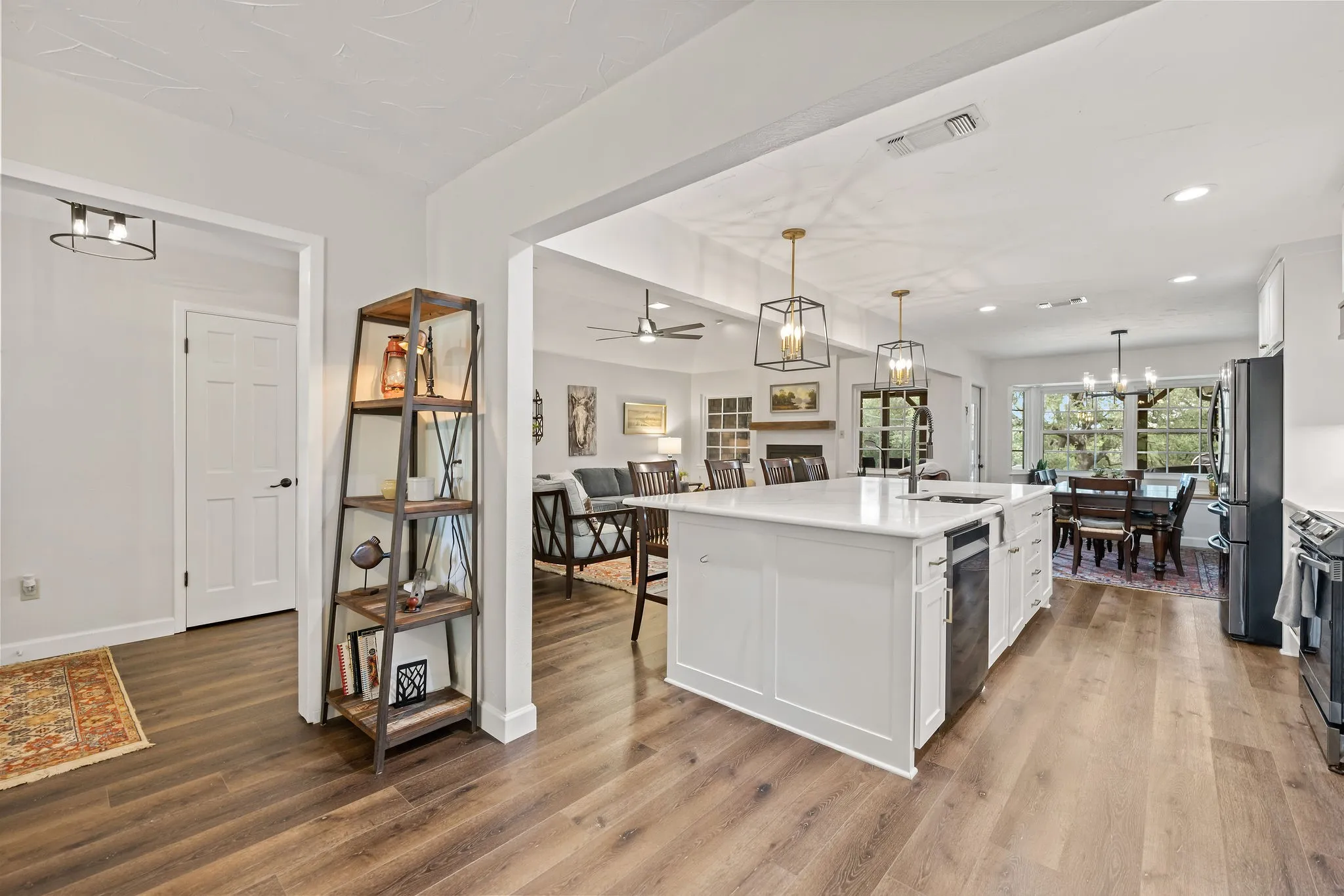 Open-concept kitchen and living area featuring wood-finish flooring throughout