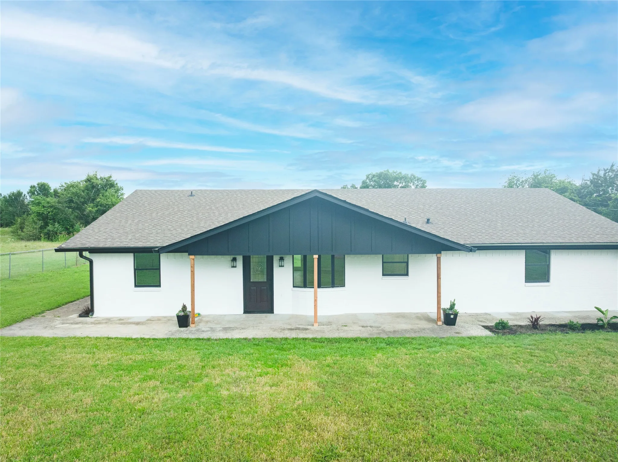 White exterior with a contrasting dark gray front gable