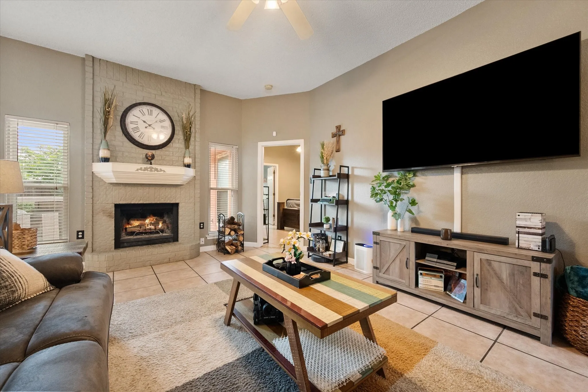 Corner fireplace with a painted brick surround and a decorative mantel