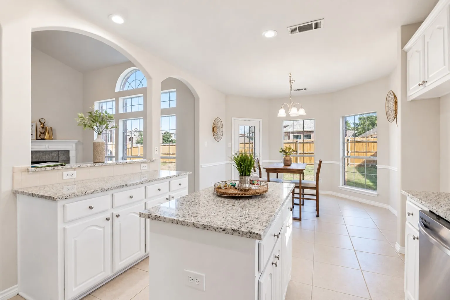 Kitchen featuring granite countertops, white cabinetry, recessed lighting, and tile flooring
