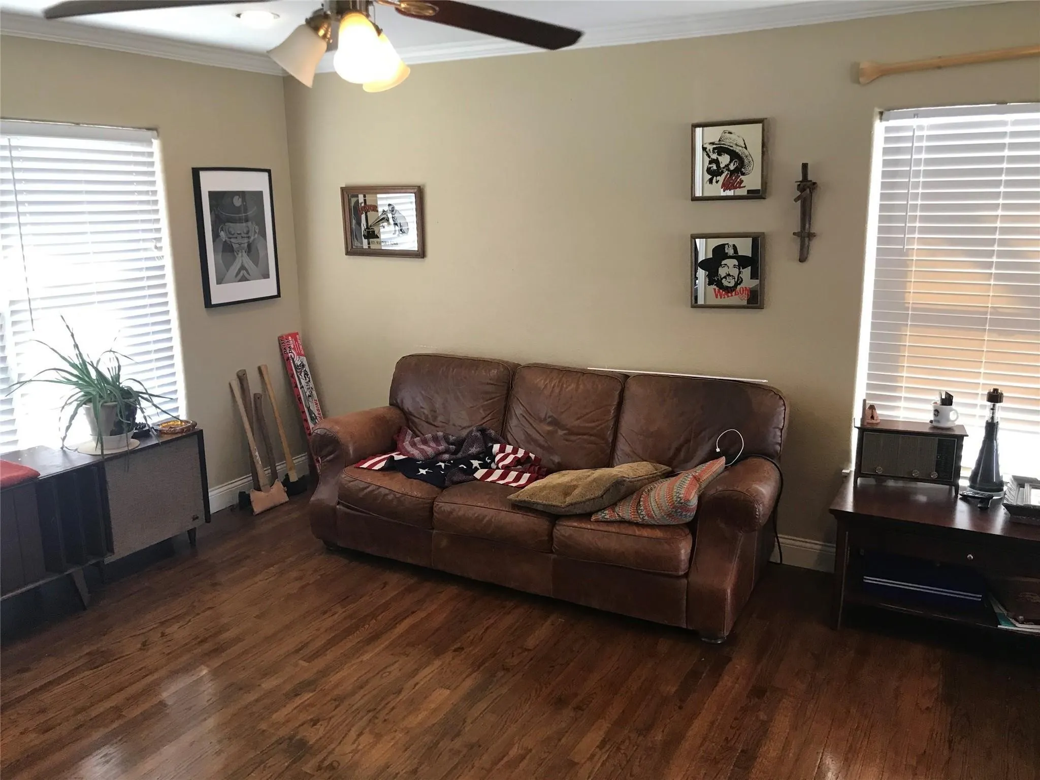 Warm-toned wood-finish flooring complements the neutral wall color