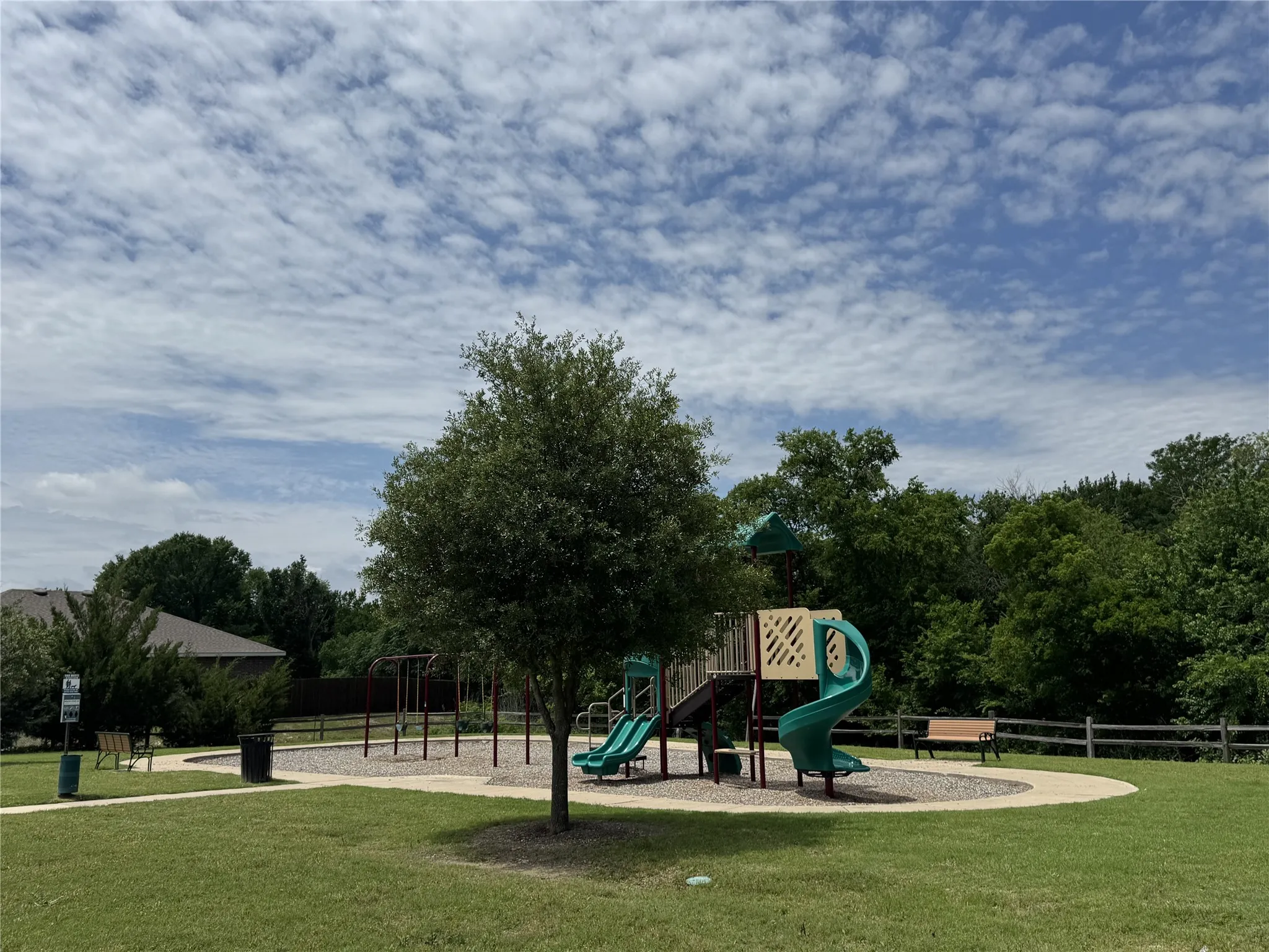 Community playground featuring multiple slides and climbing structures