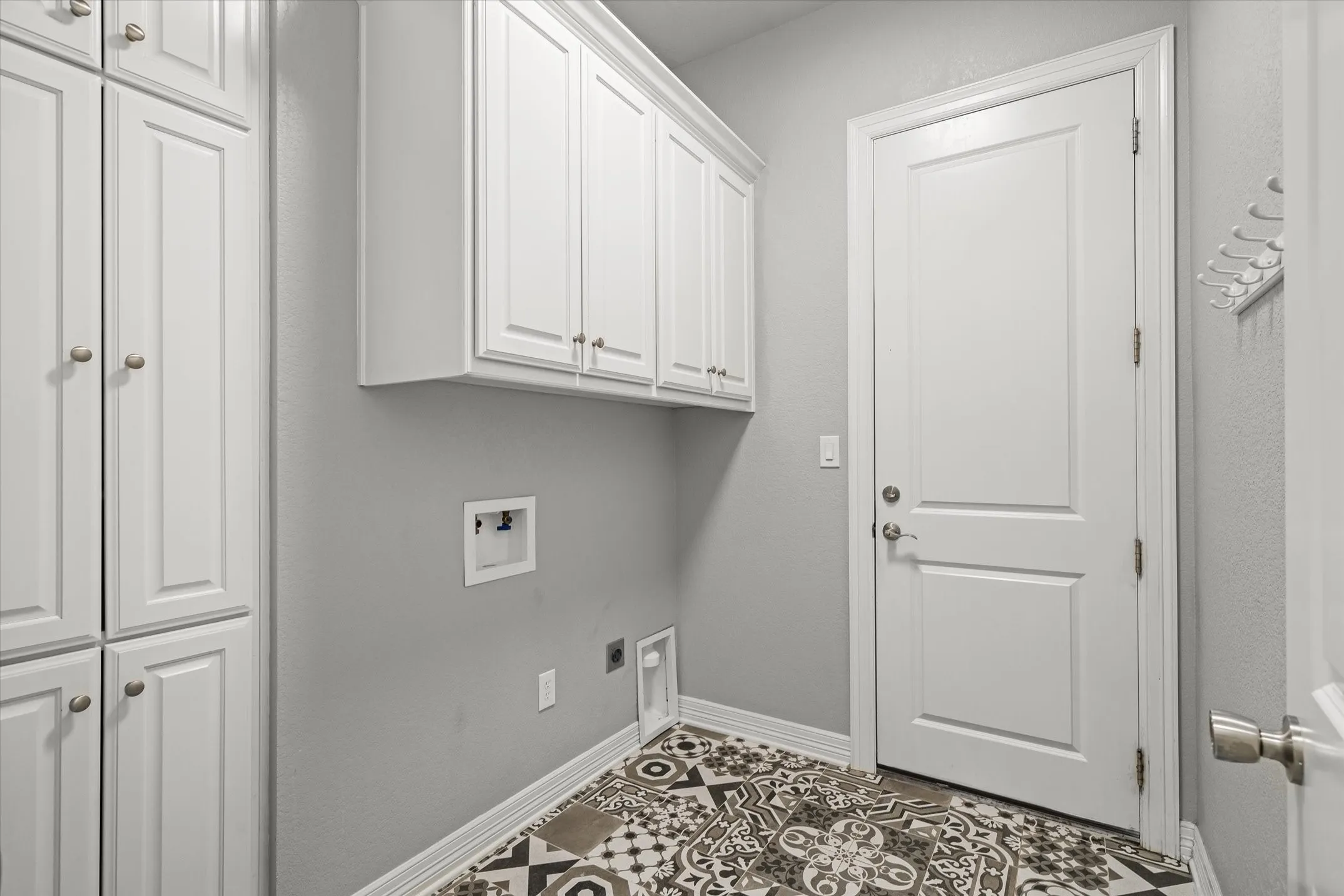 Laundry room with extra pantry space leads out to the 3 car garage