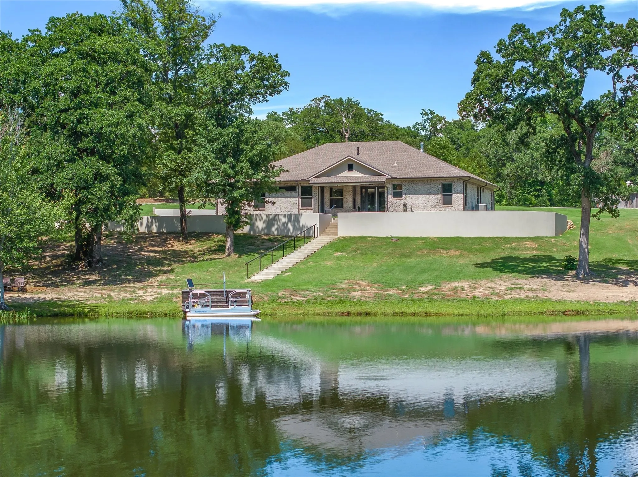 Beautiful home on a private spring fed lake ready to fish!