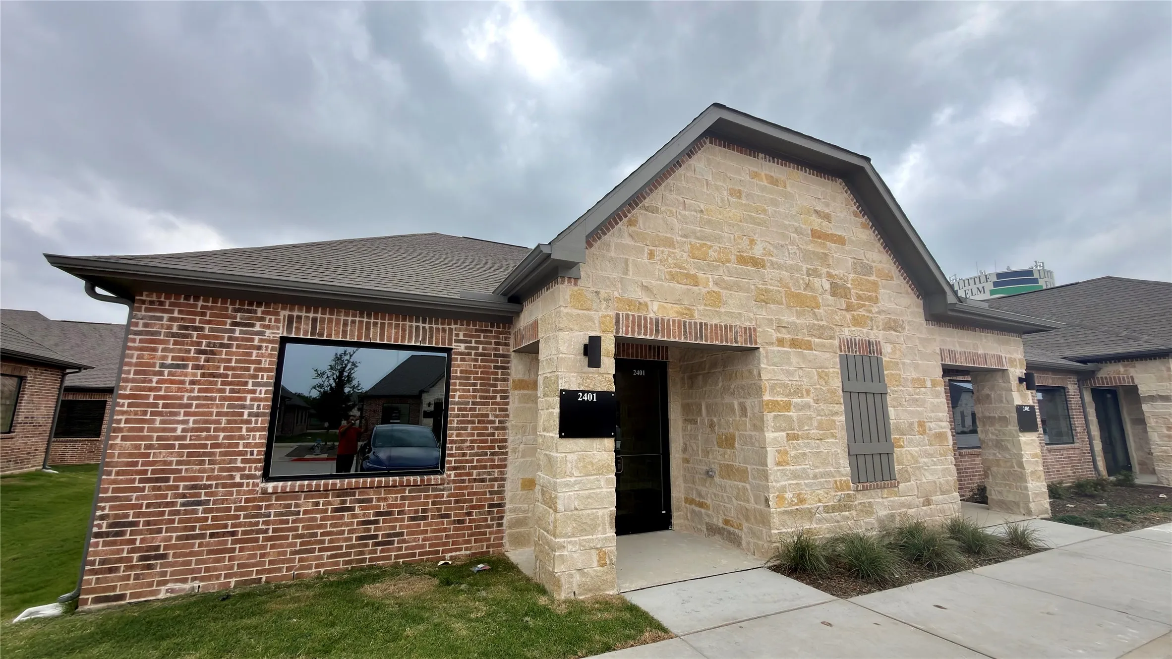 Brick and stone exterior with a gabled roofline