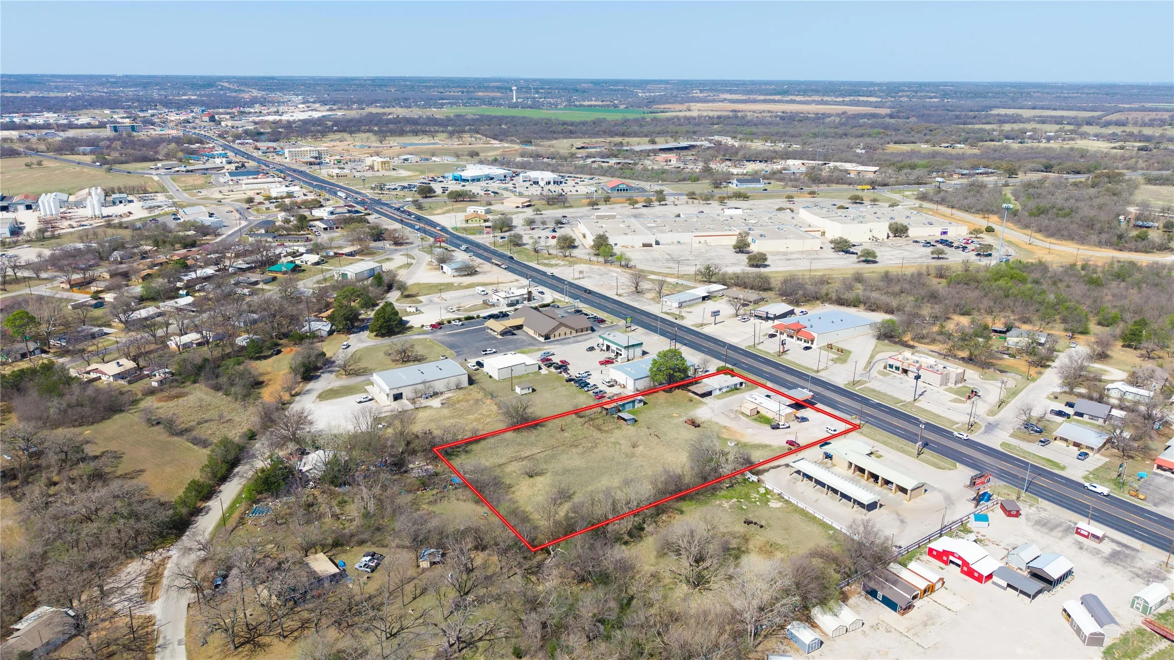 Expansive commercial lot featuring direct road frontage and a flat, cleared topography