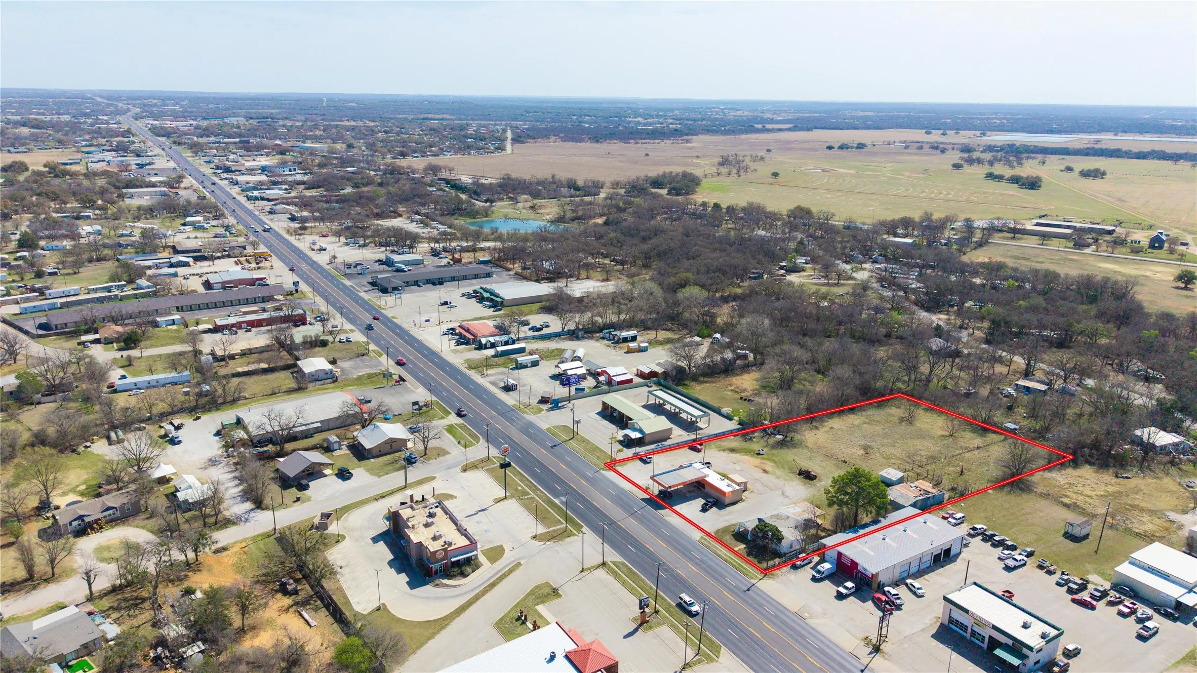 Expansive commercial land parcel with direct highway frontage