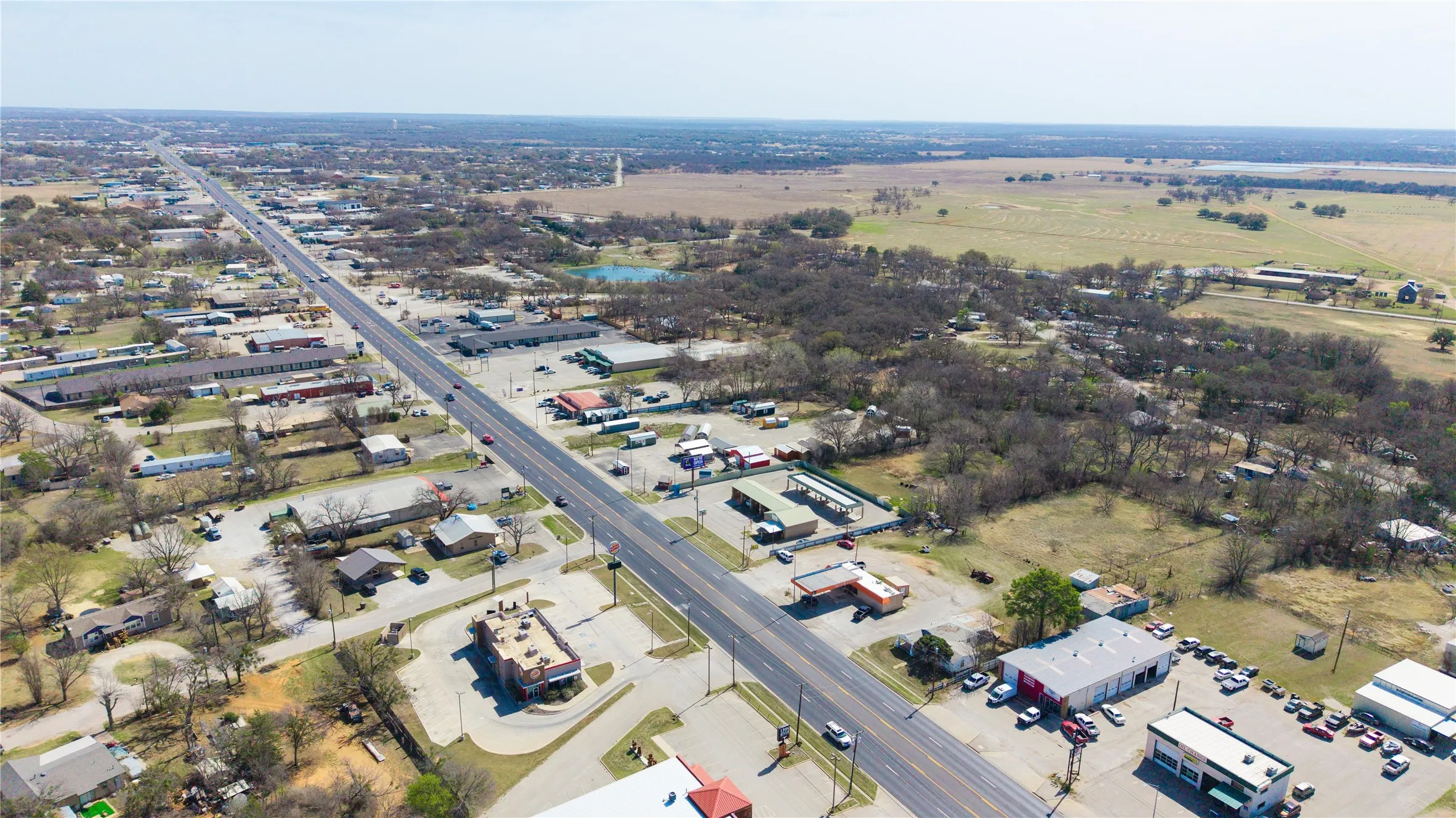 Aerial perspective showcasing a major thoroughfare traversing a commercial and residential area