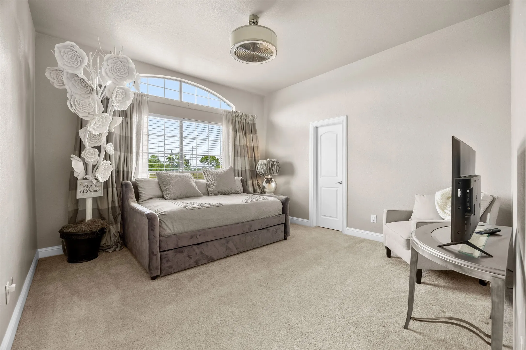 Bright & spacious secondary bedroom featuring a large walk-in closet and abundant natural light.