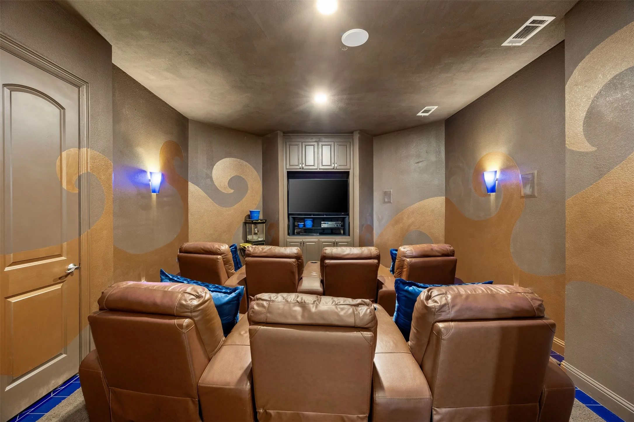 Dedicated theatre room designed for movie nights & entertaining, complete with built-in media space & additional closet storage.