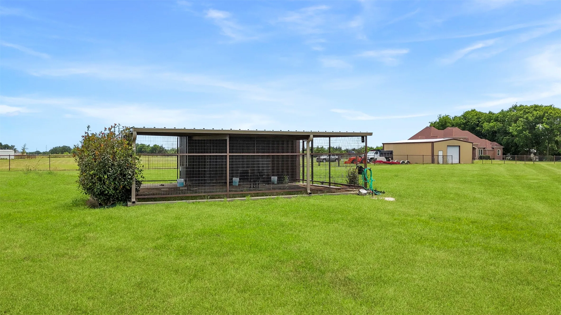 30x30 fenced kennel with water access offers endless possibilities for dogs, chickens, livestock, or additional outdoor storage.