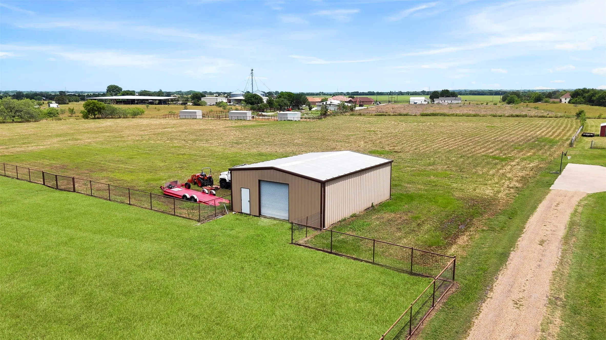 Spacious 30x40 shop with roll-up door, ideal for equipment storage, hobbies, RV/boat parking or workshop space