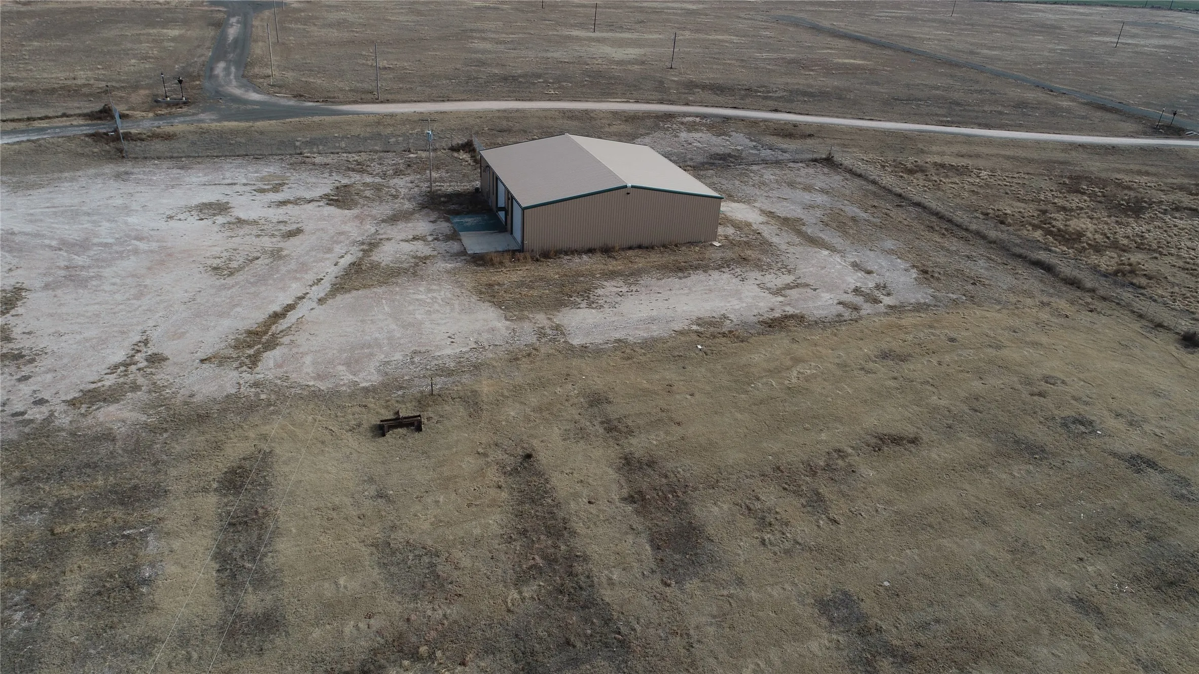 Birds eye view of property with a rural view
