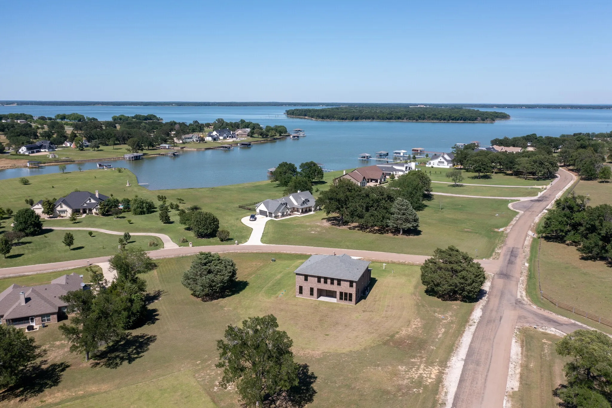 Aerial perspective showcasing a residential development with a waterfront setting