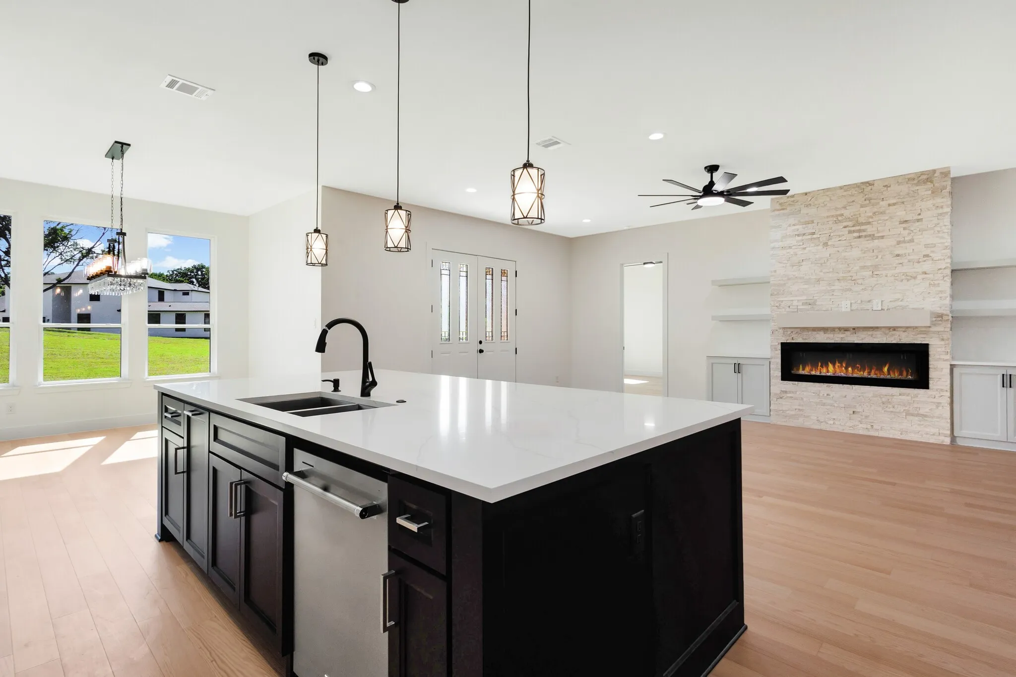 Spacious kitchen island with a white countertop and dark wood-finish cabinetry