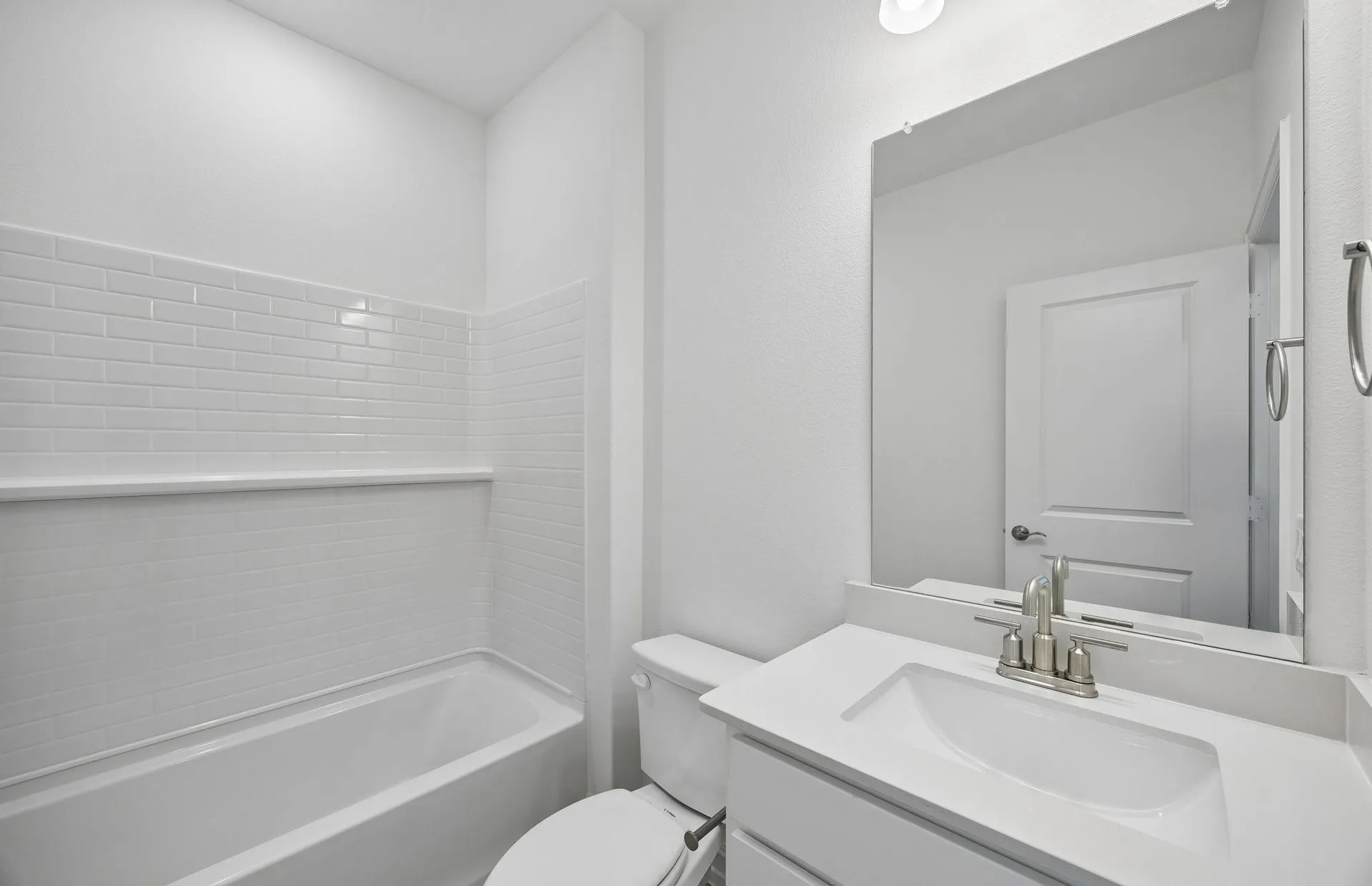 Secondary bath with tile surrounded shower