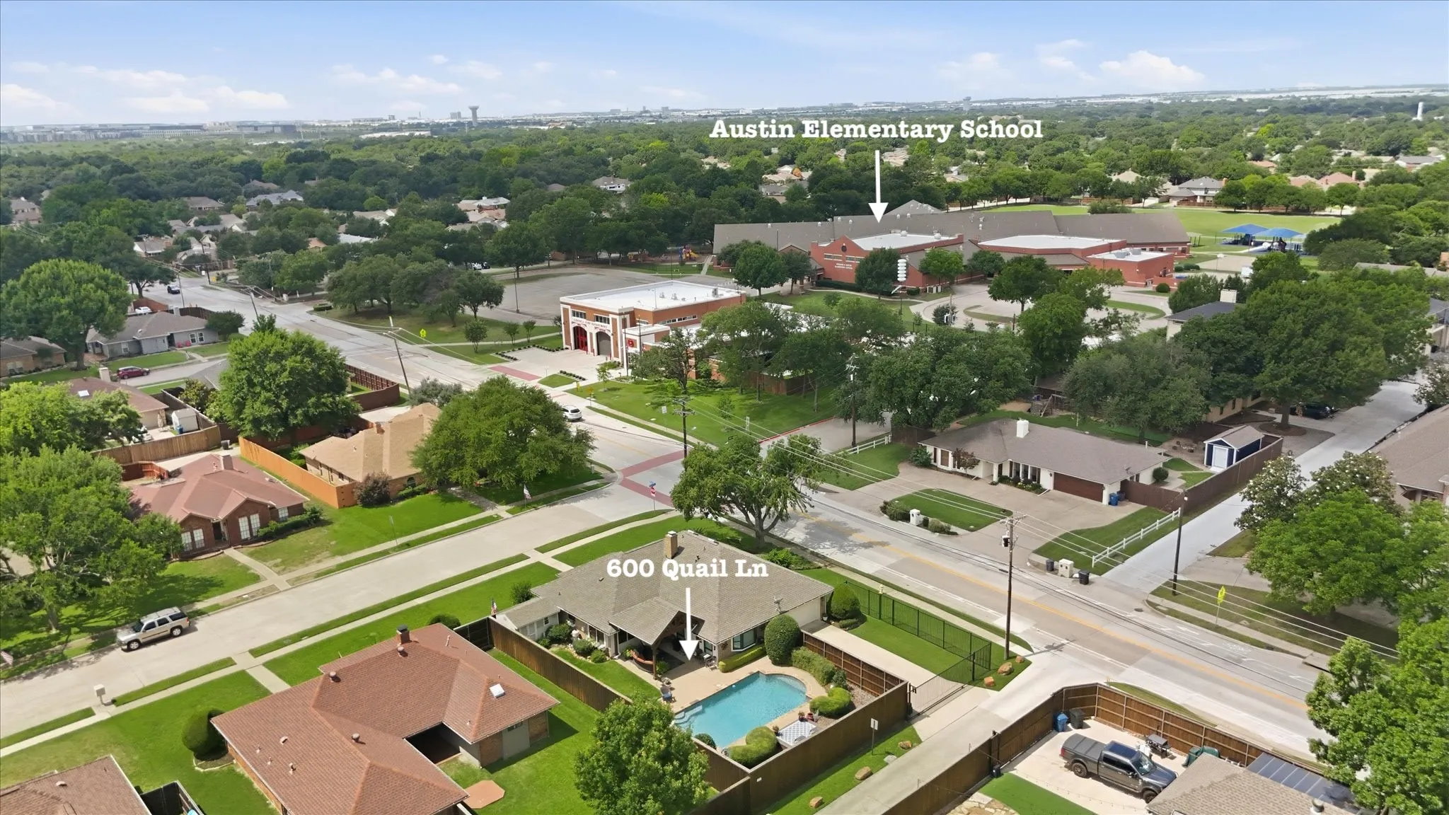 Aerial perspective showcasing the property with a private swimming pool and surrounding green spaces