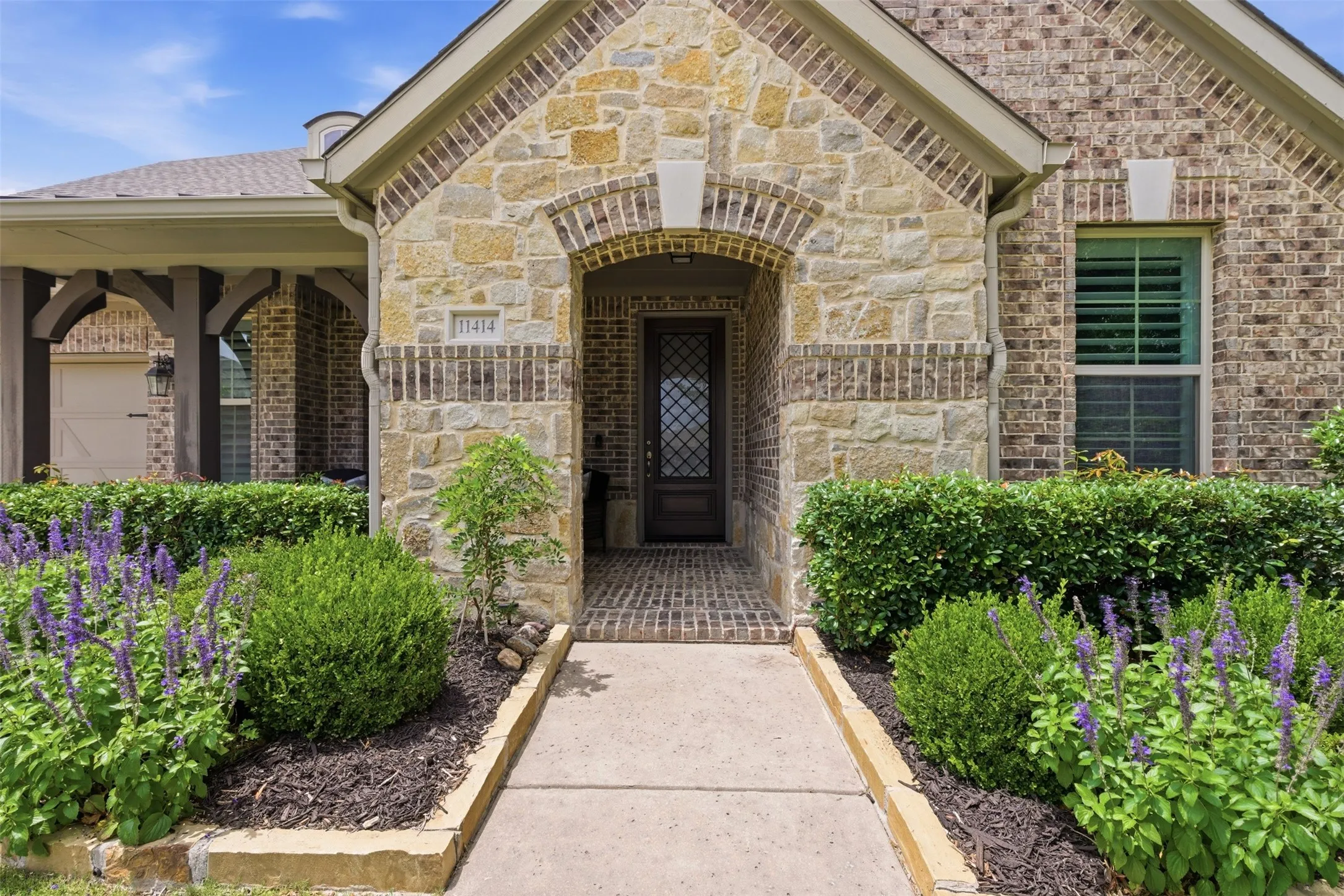 Stone and brick exterior with arched entryway