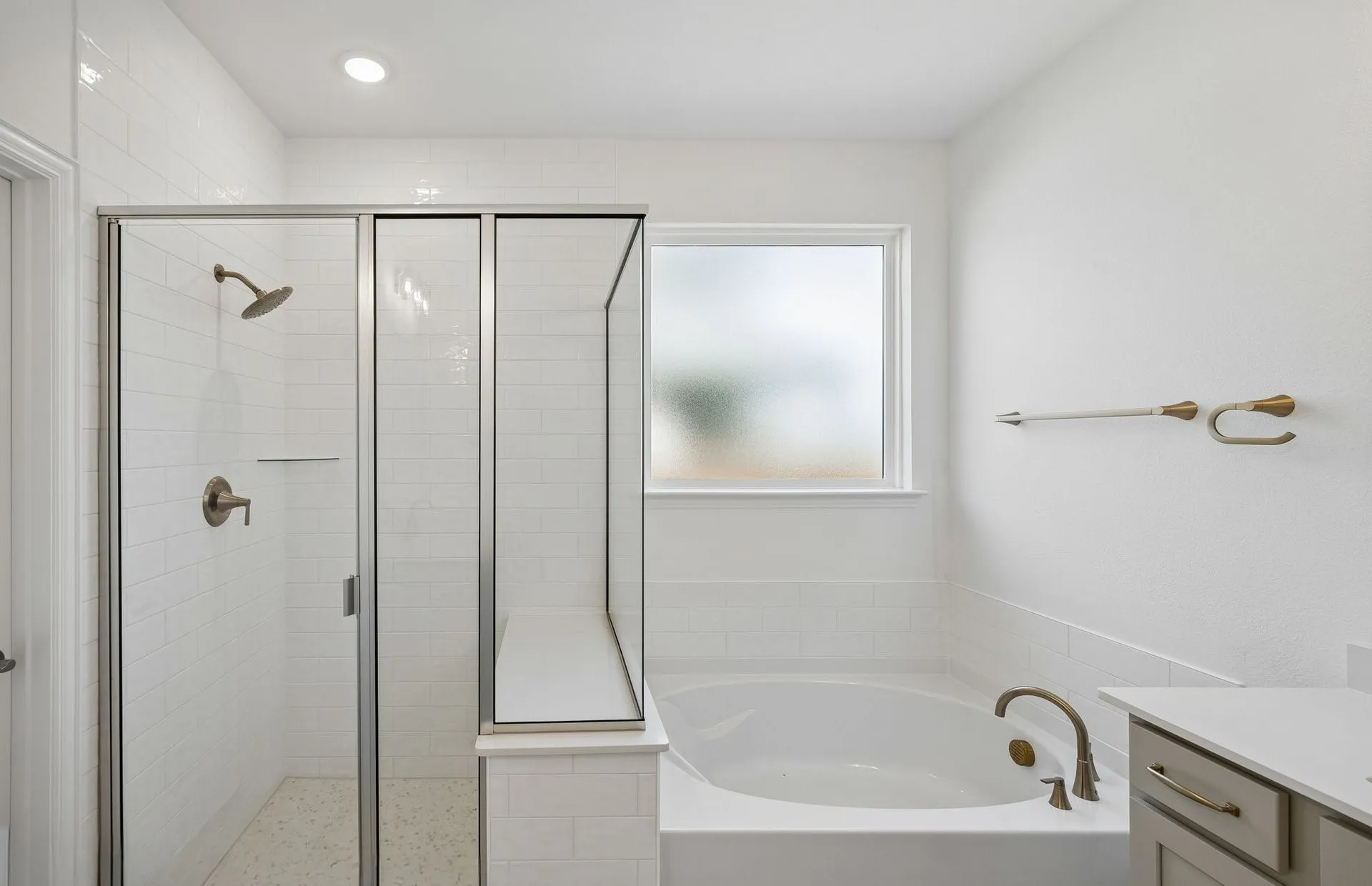 Owner's bath with tub and shower