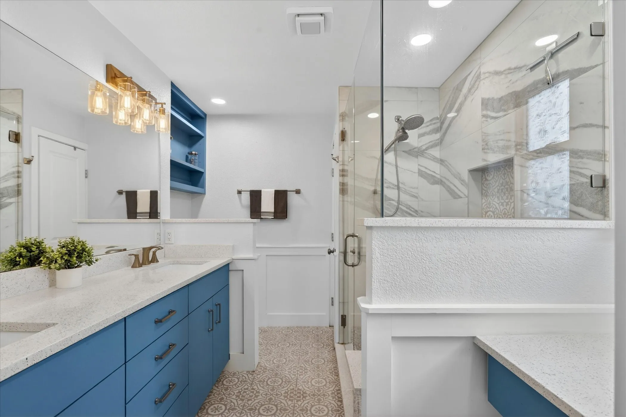 Kitchen featuring wood cabinetry, stainless steel microwave, and electric range