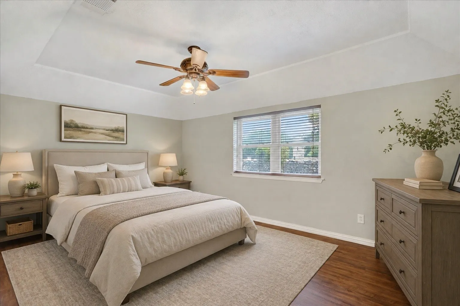 Virtually StagedTray ceiling with a ceiling fan light fixture, wood-finish flooring, and a large window with blinds