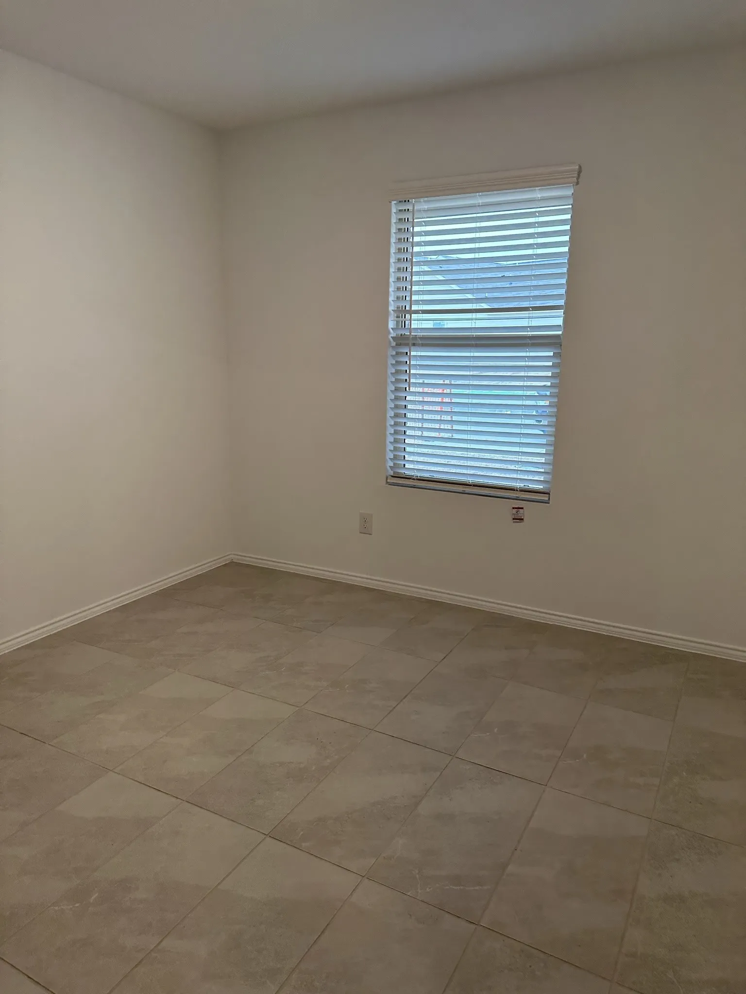 View of tiled spare room