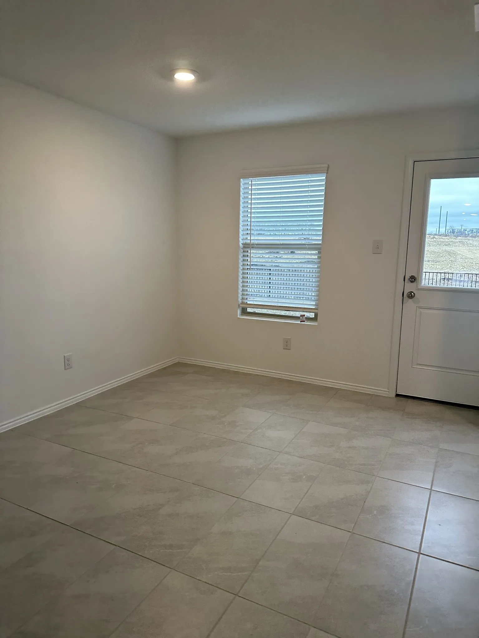 View of tiled spare room