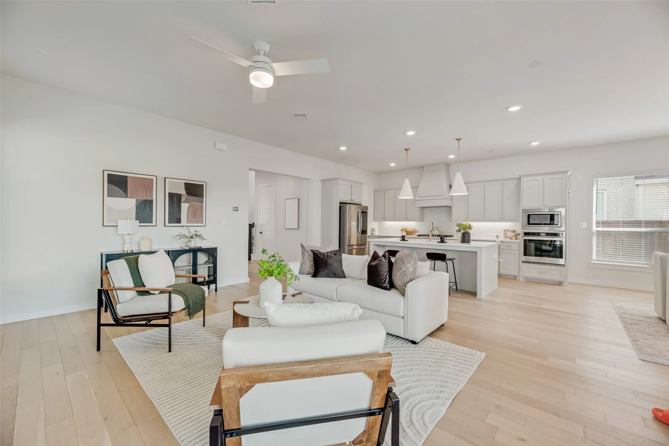 Charming well- kept home with open concept living area featuring gorgeous white oak finish flooring as well as spacious kitchen overlooks dining and living room.
