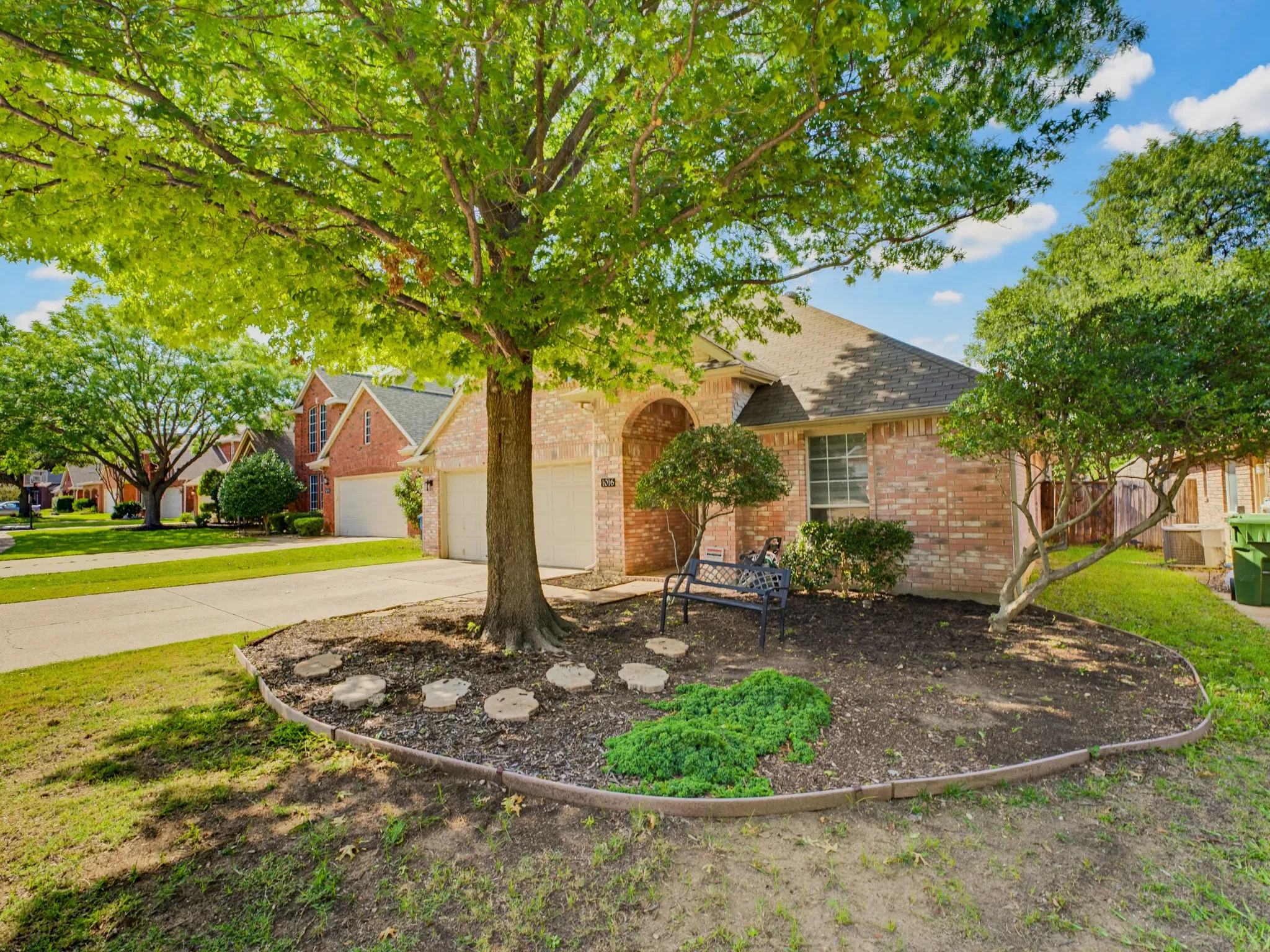 Brick facade home with an arched entry