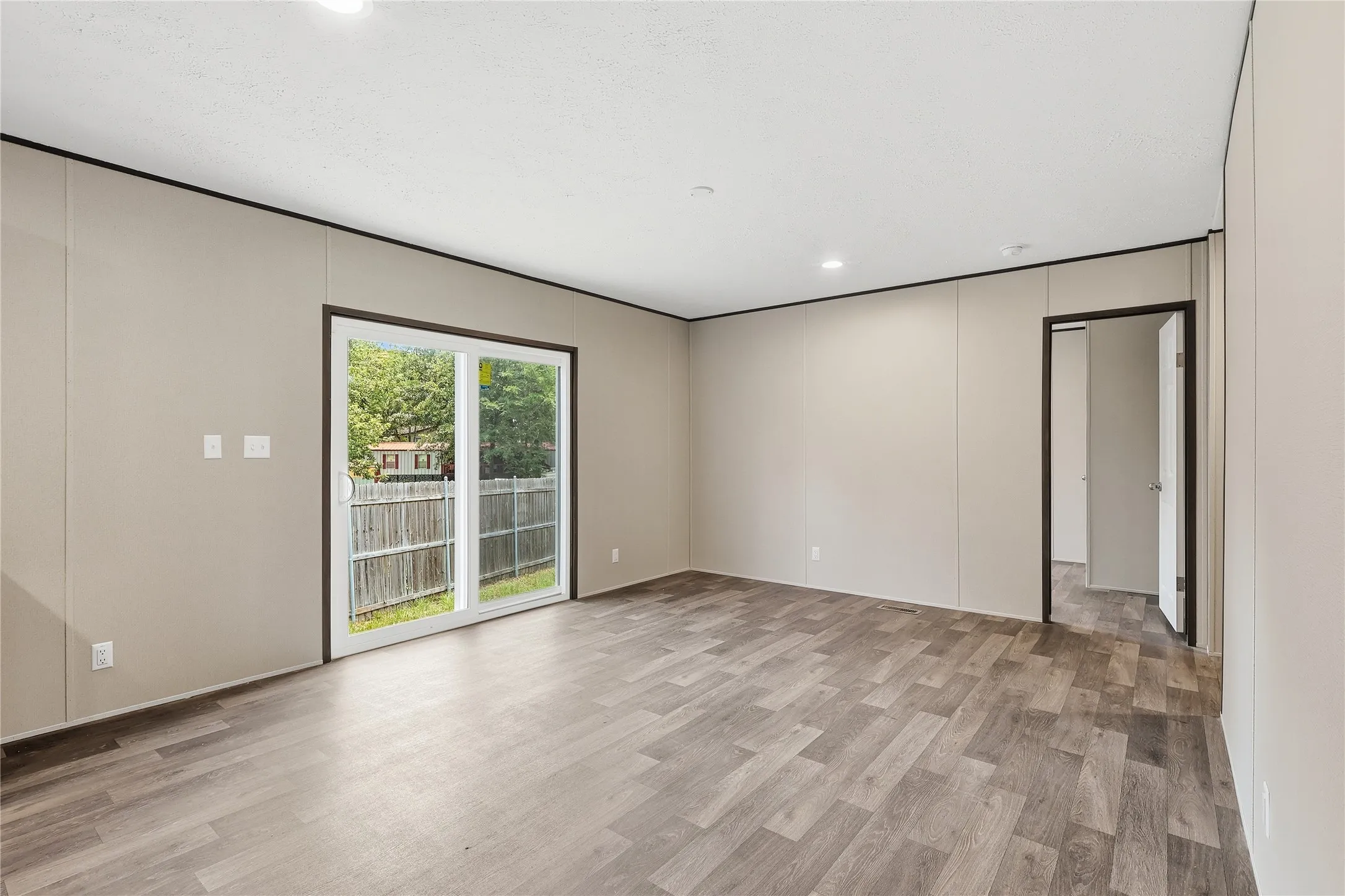 Sliding door leads to back of home.