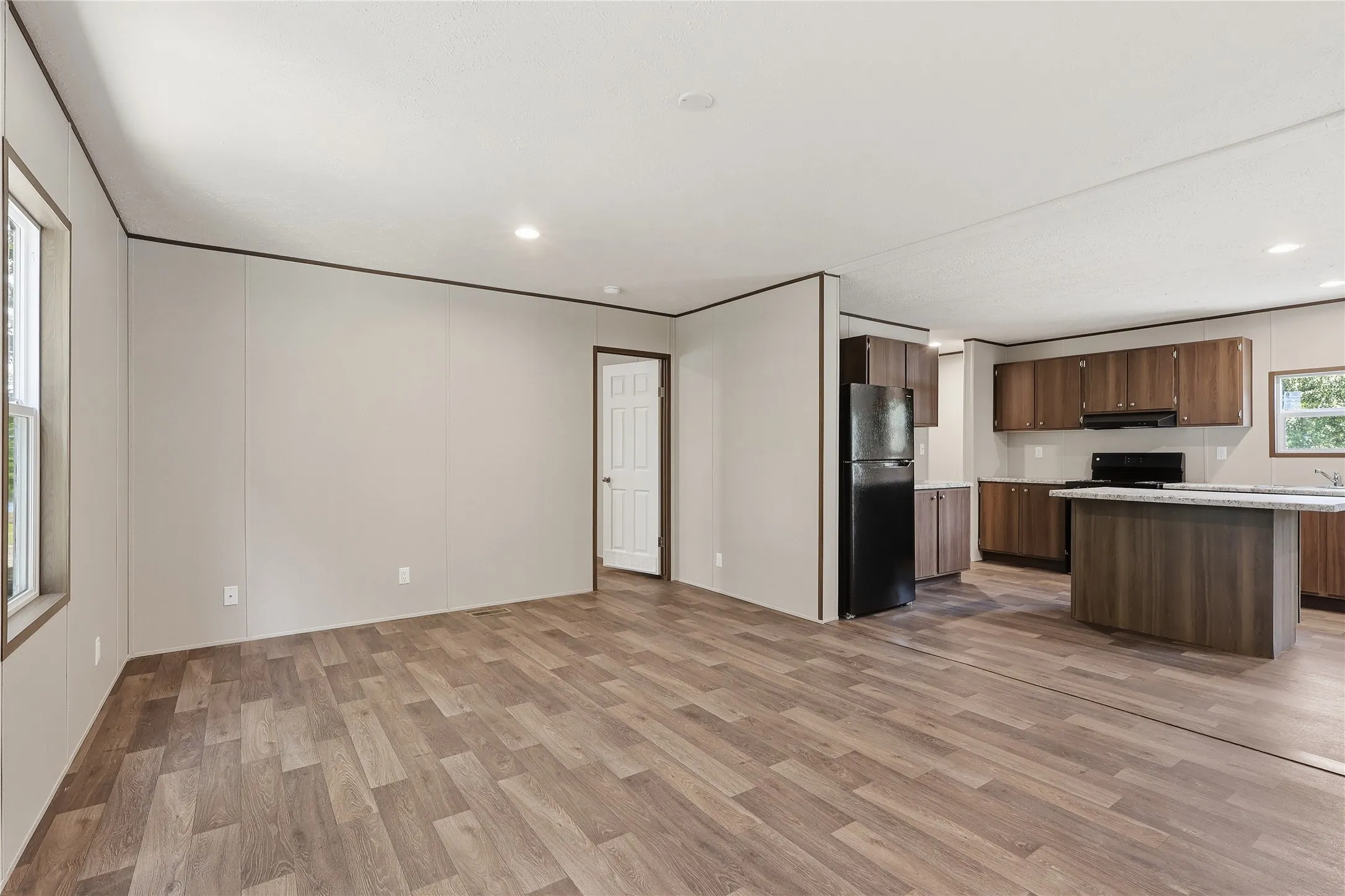 Open concept living room and kitchen area.