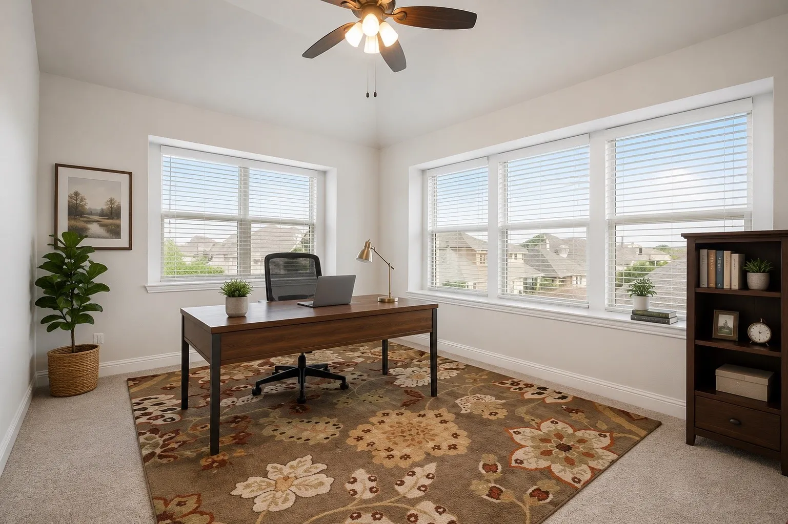 Bright room with multiple windows and a ceiling fan