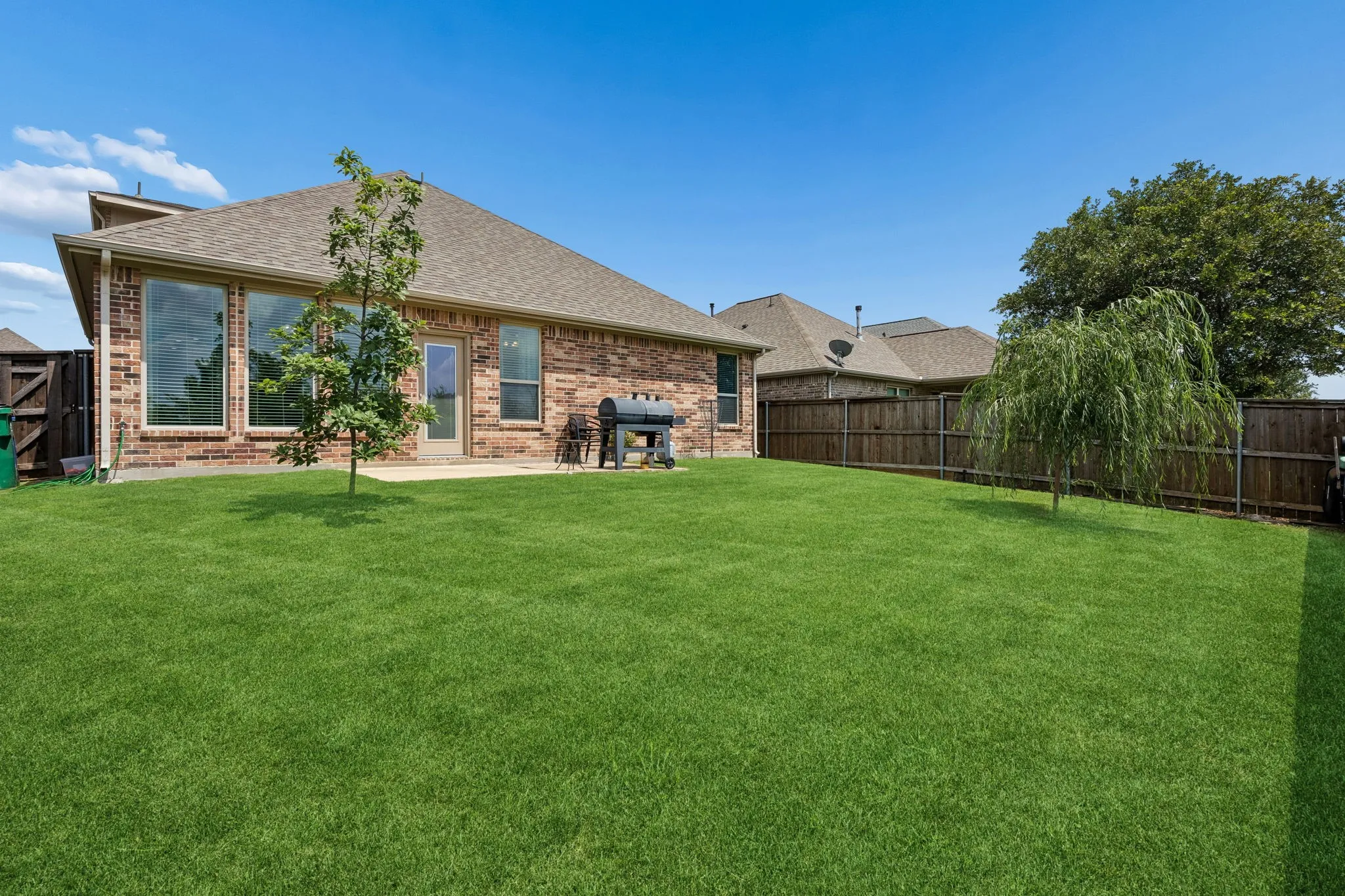 Looking at the back of the home from the yard.