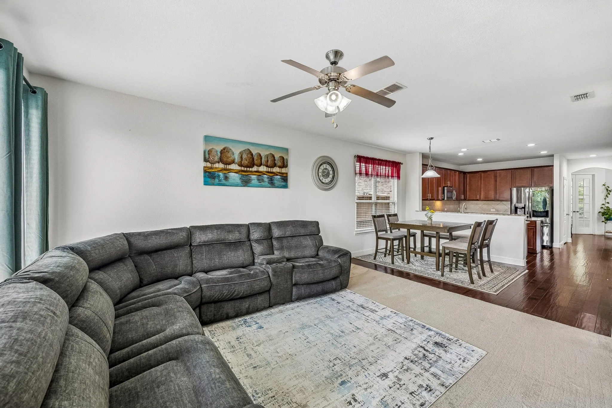 Living area is open to the kitchen and dining