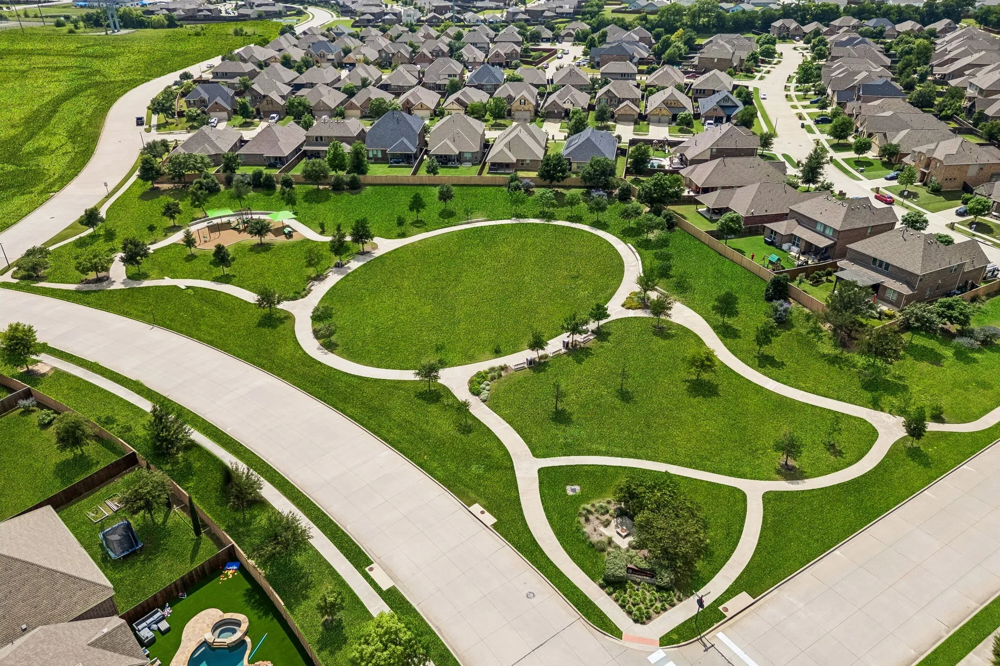 A community walking path and playground area.