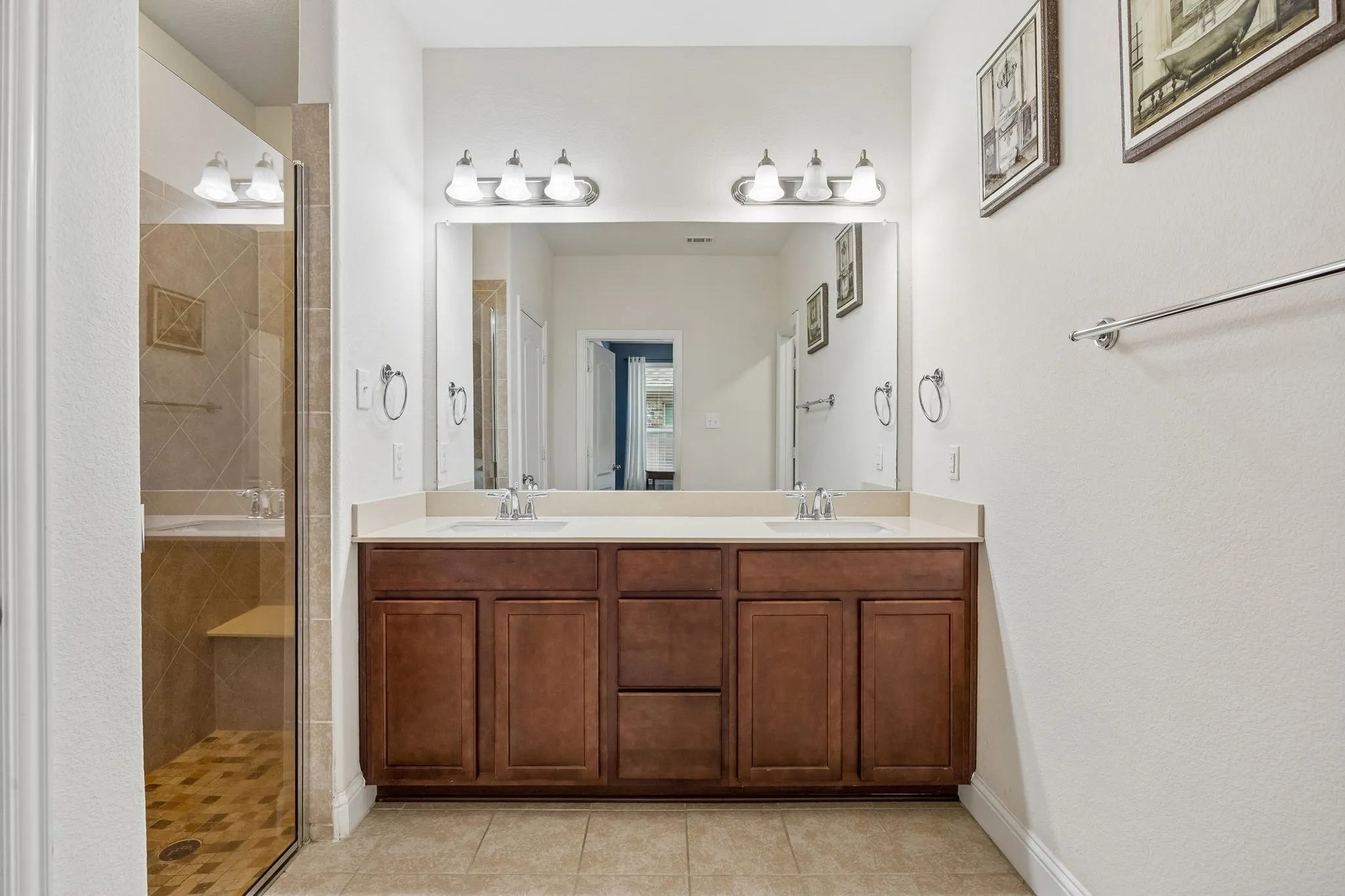 Bathroom featuring a large vanity with two sinks