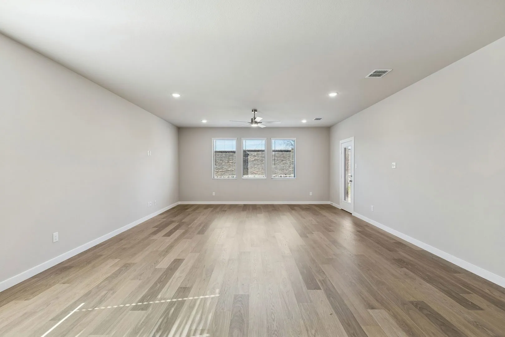Living and Dining Room in the Holden home plan by Trophy Signature Homes – REPRESENTATIVE PHOTO